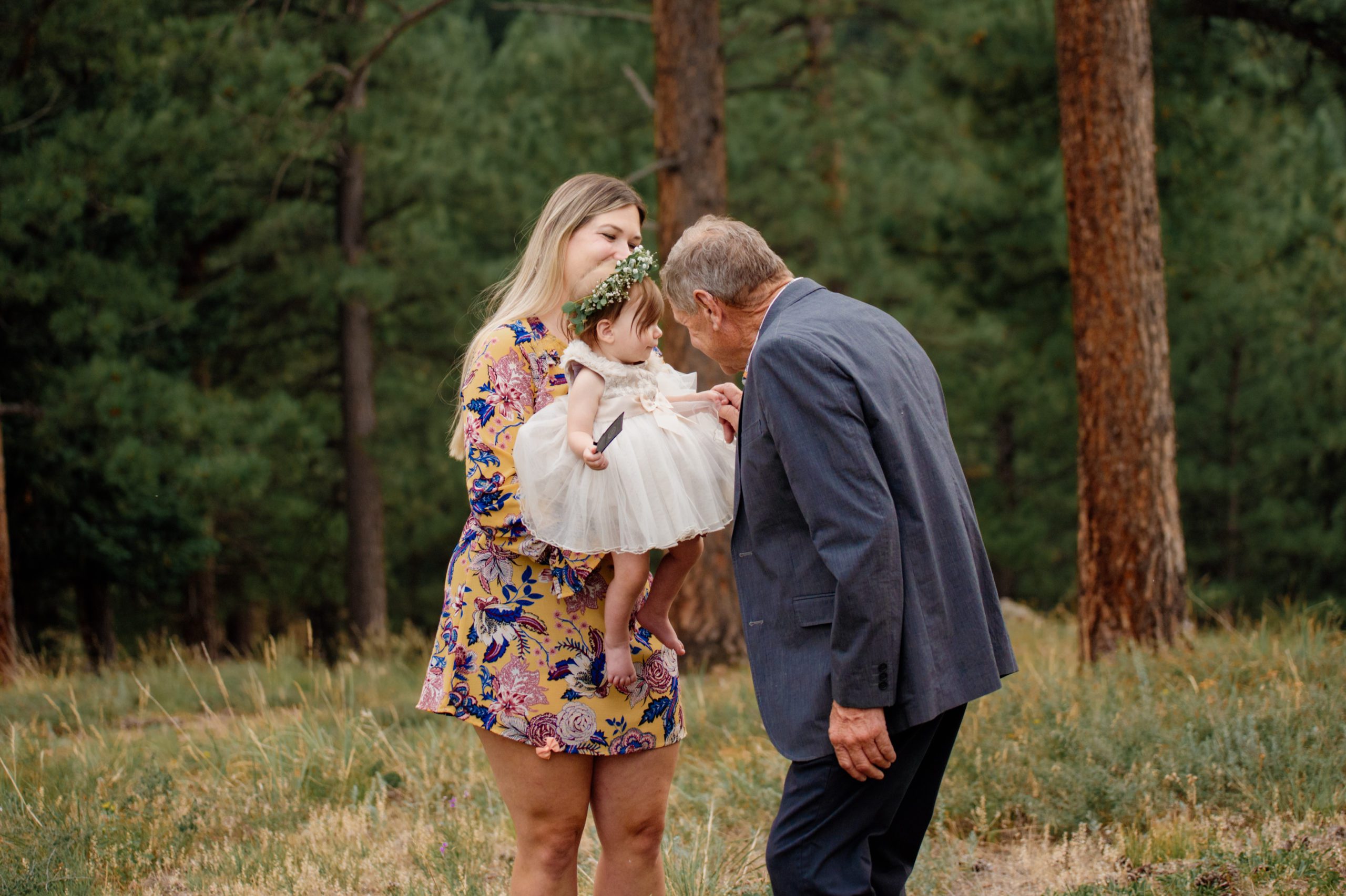 The Father of the bride says hello to his granddaughter after his daughter's Artist Point elopement. 