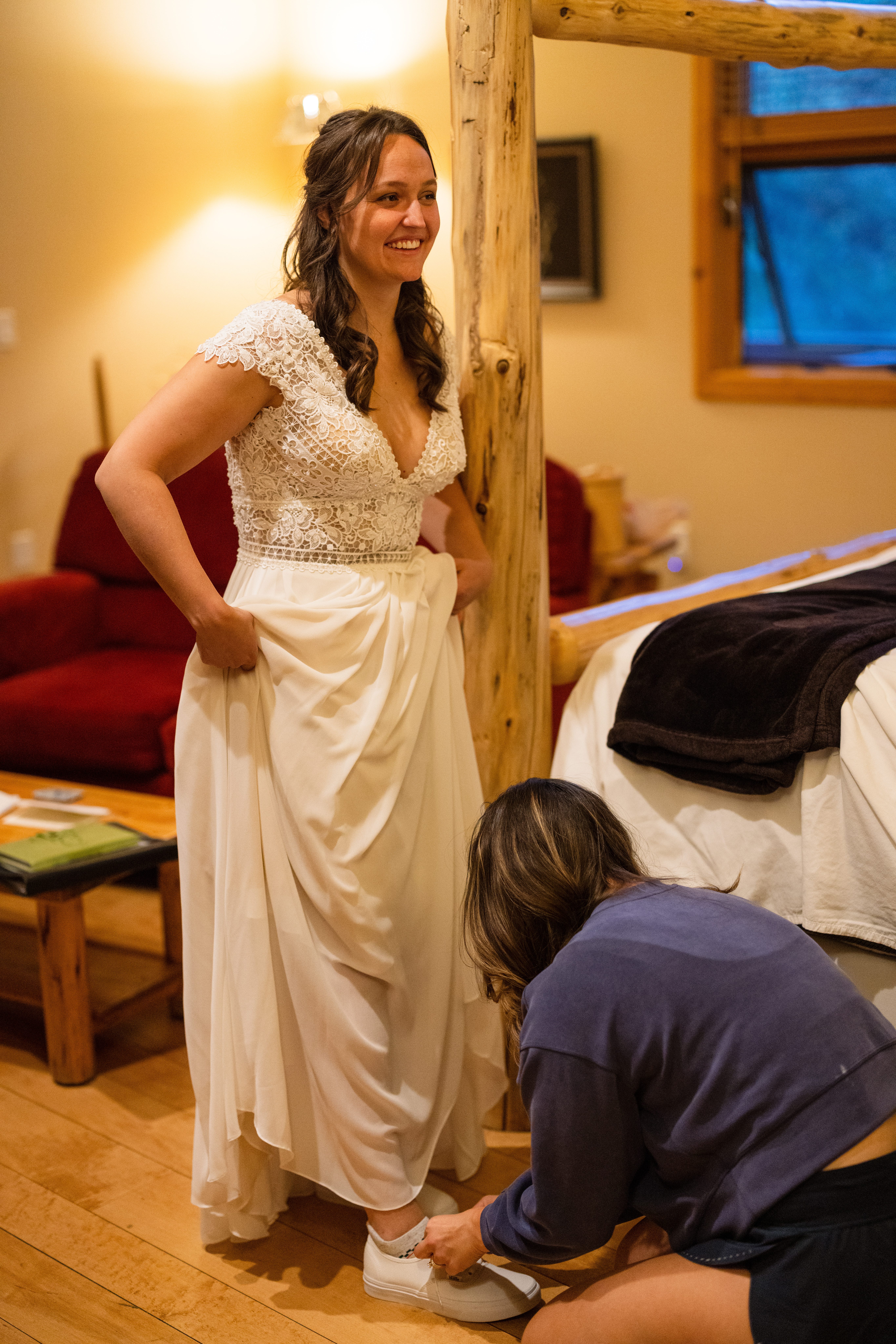 The beautiful bride finishes getting ready at Romantic RiverSong Inn in Estes Park for her wedding 