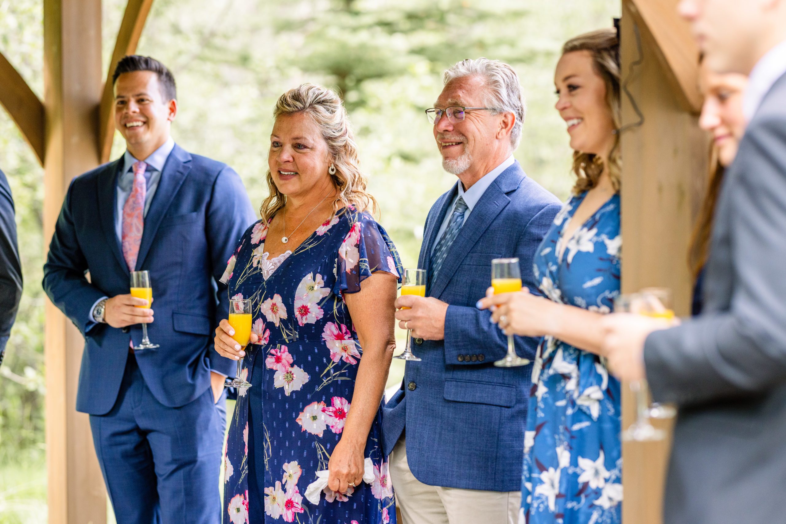 A shot of the guests smiling, and listening to speeches during the reception at Romantic RiverSong Inn in Estes Park. 