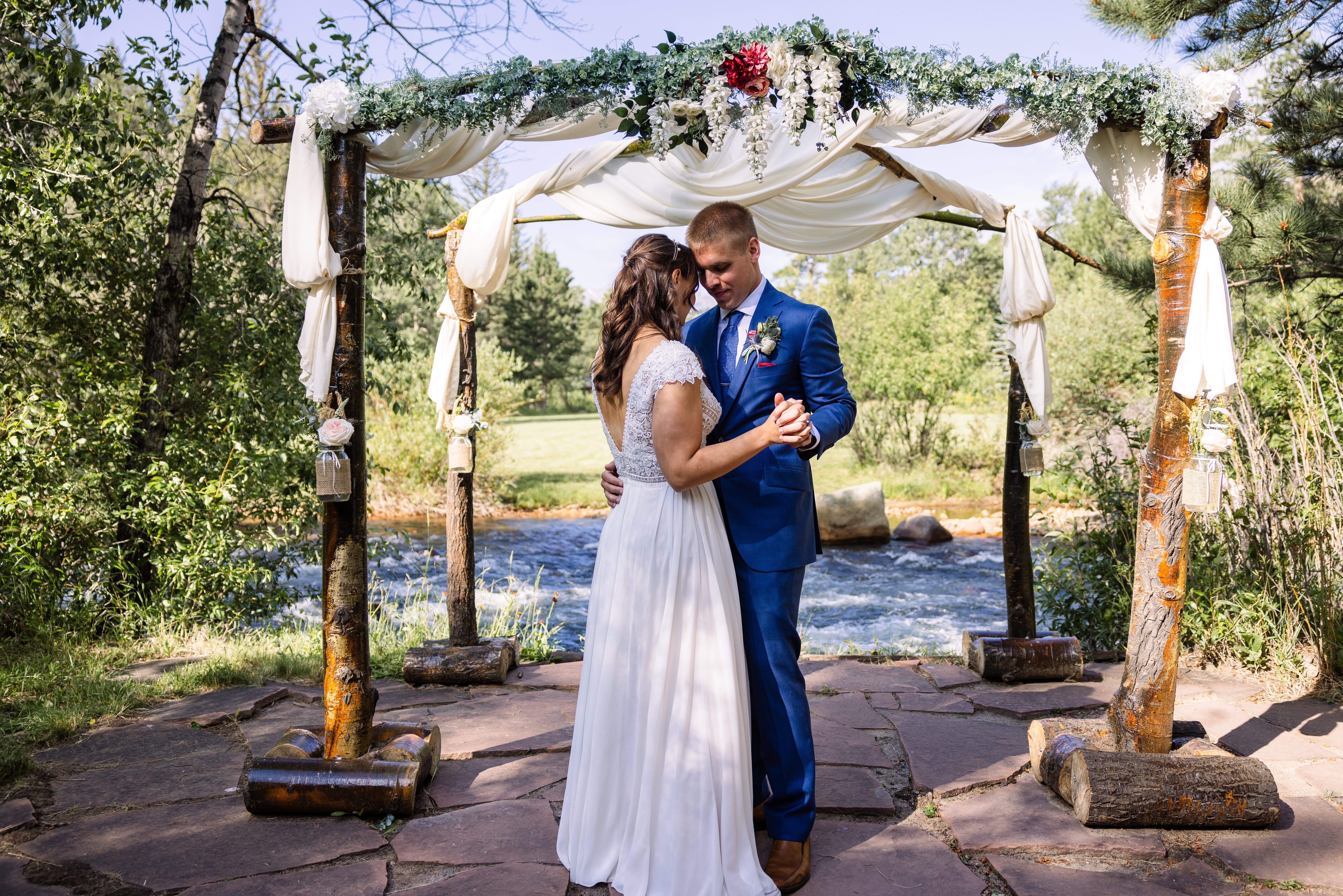 The bride and groom share their first dance at the wedding at Romantic RiverSong Inn in Estes Park. 