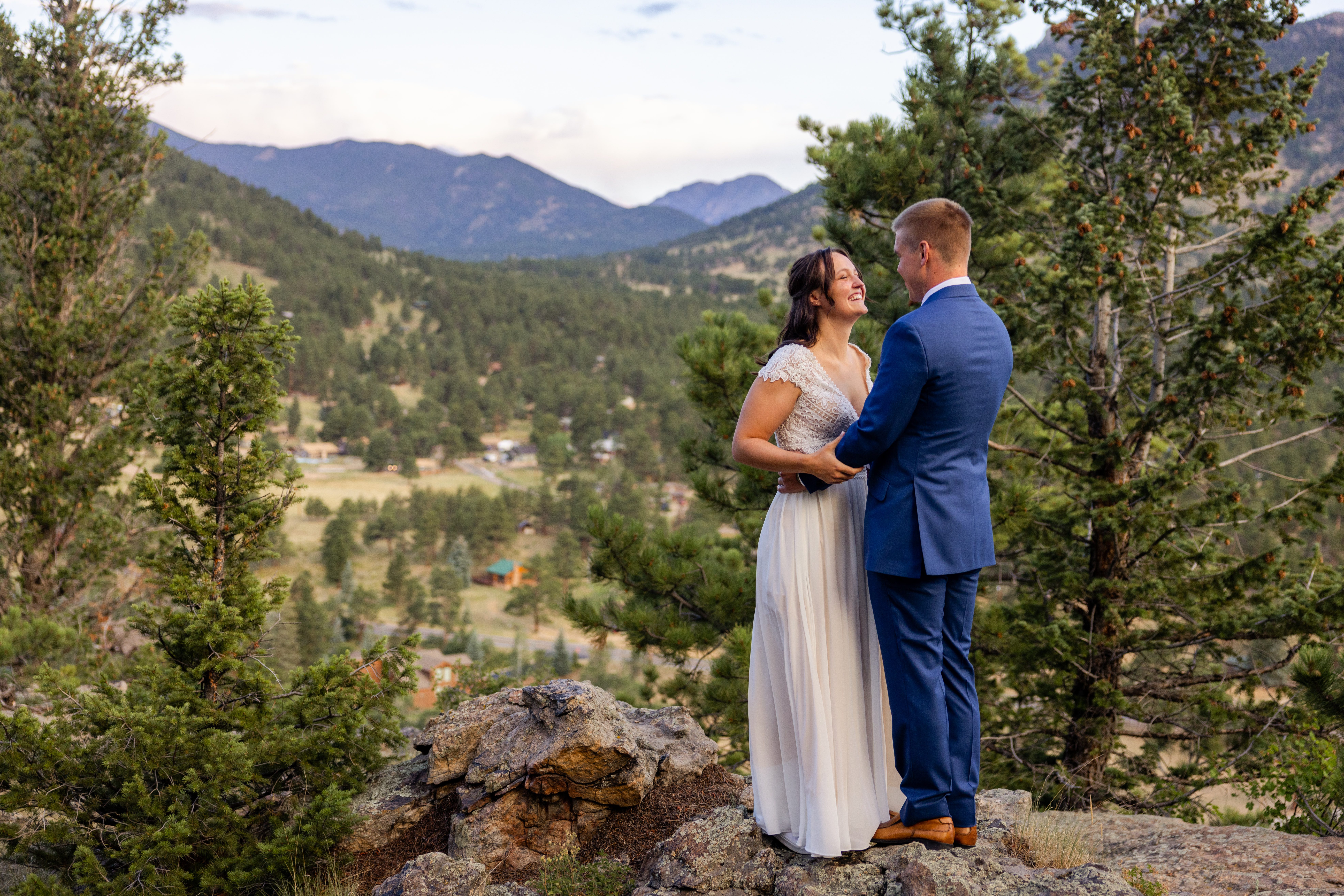 the bride and groom explore the trail at Romantic RiverSong Inn in Estes Park on their wedding day