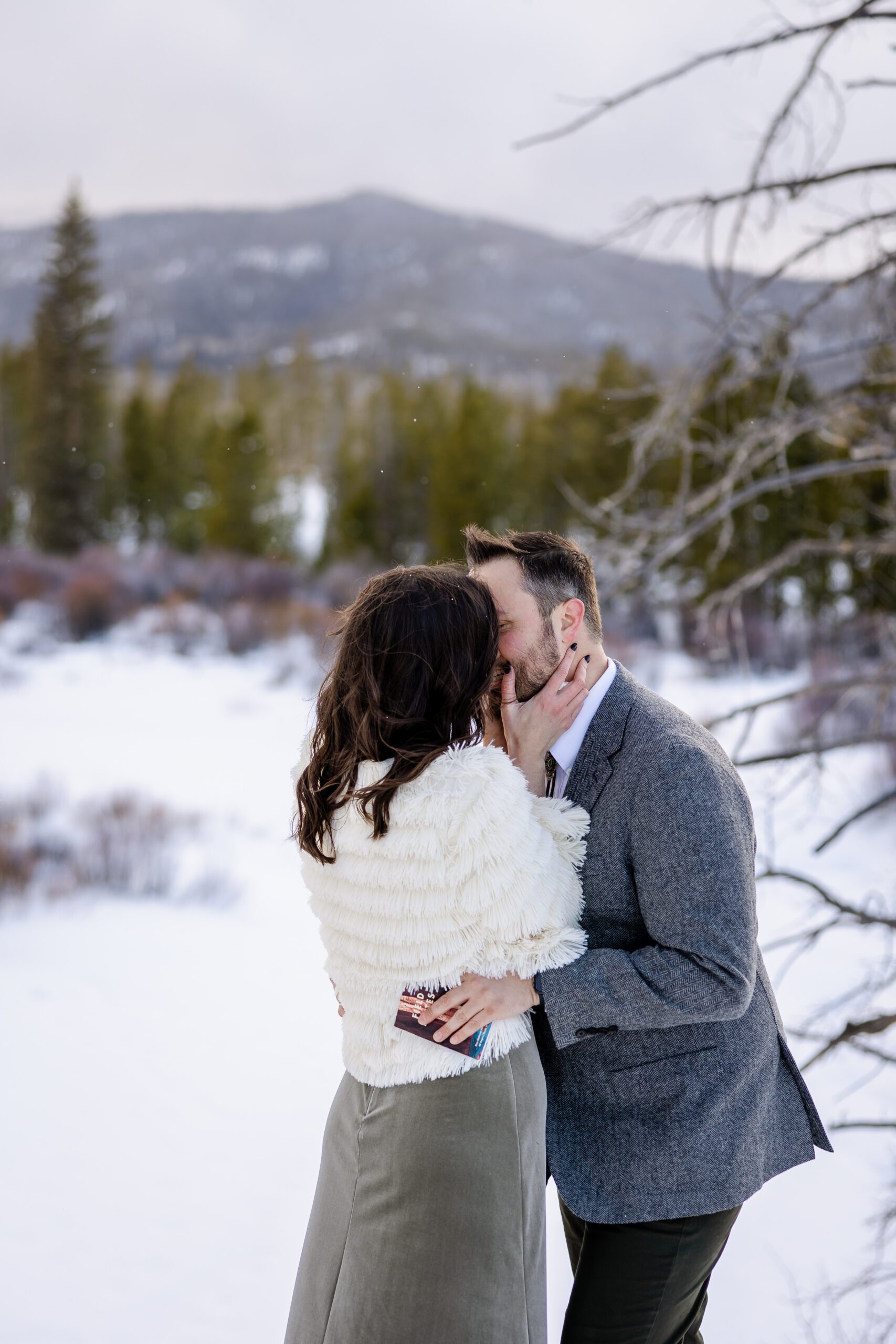 the bride kisses her groom at their Winter Park elopement ceremony. 