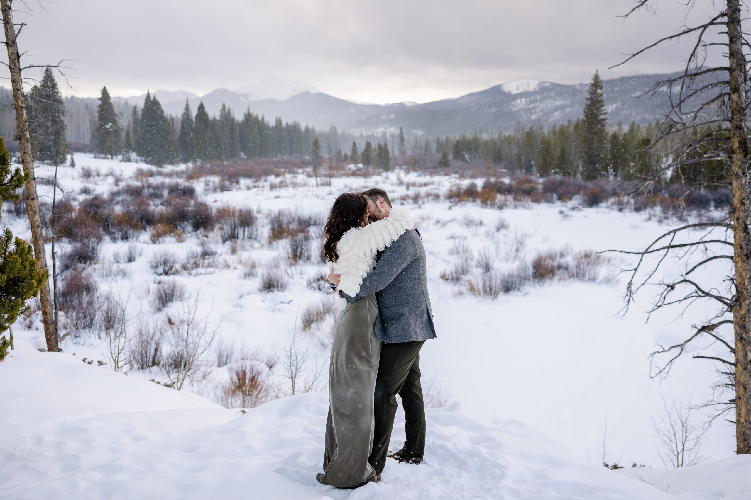 the bride wrapped her arms around her groom for a kiss at their Winter Park elopement ceremony. 