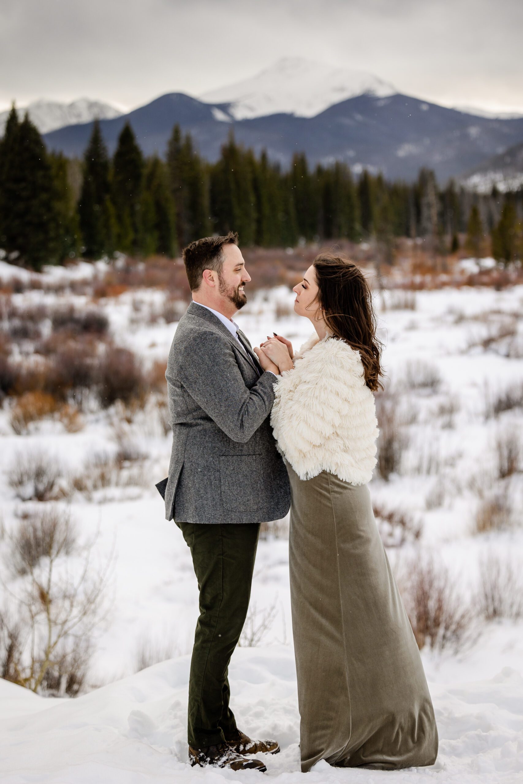 the bride and groom holding hands at looking at each other in the eyes at their Winter Park elopement.