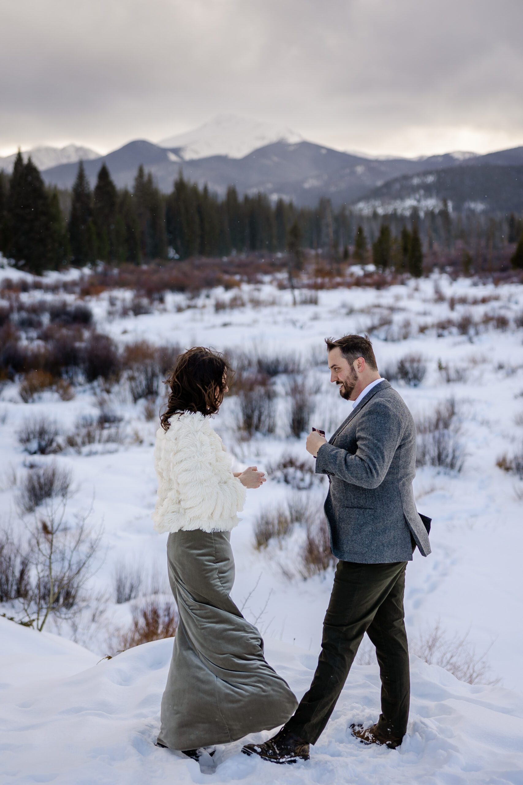 The groom reaching into his jacket for his vow book during their Winter Park elopement ceremony. 