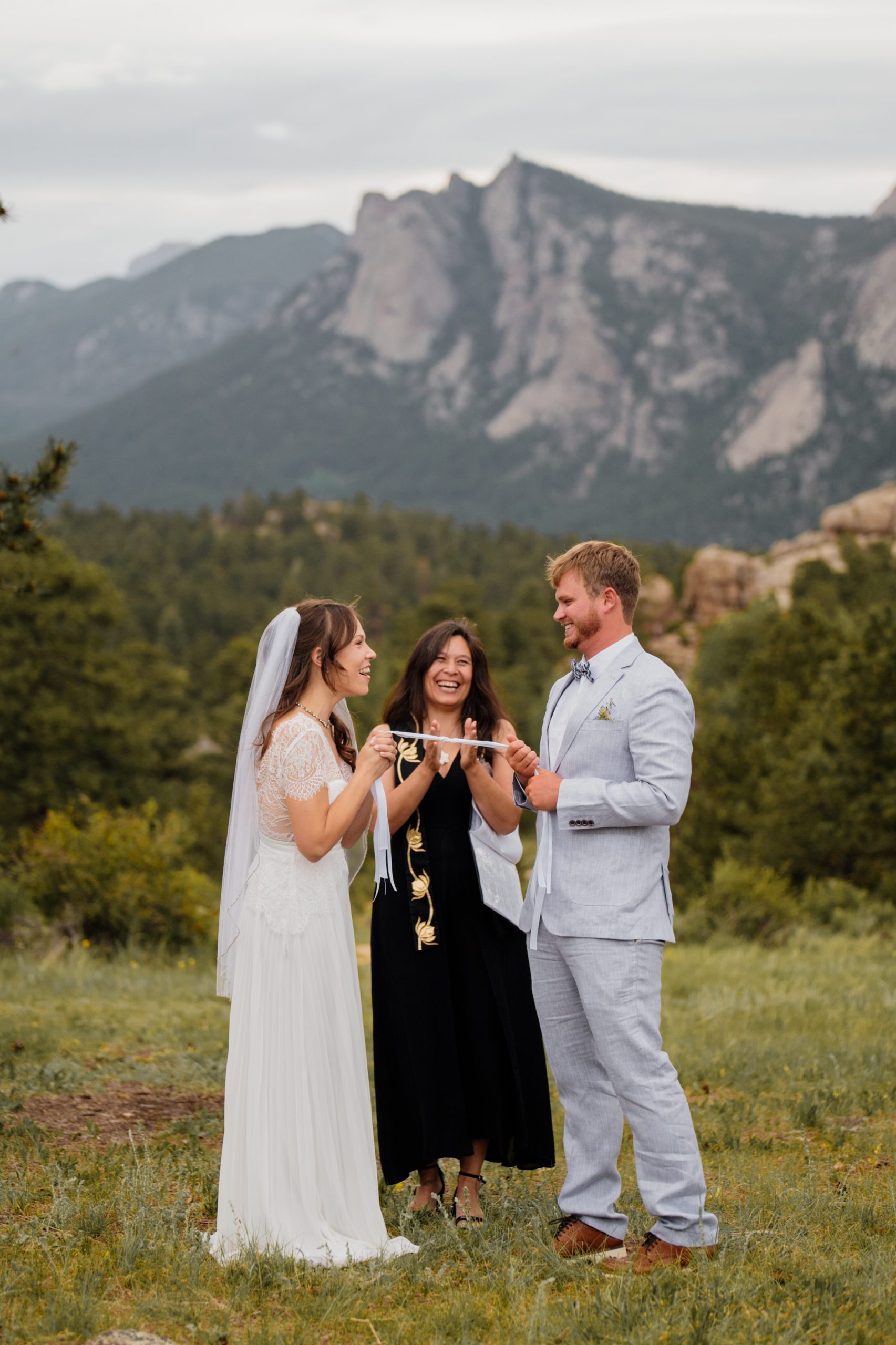 Another shot of the bride and groom smiling during their elopement ceremony at Knoll Willows in Estes Park.