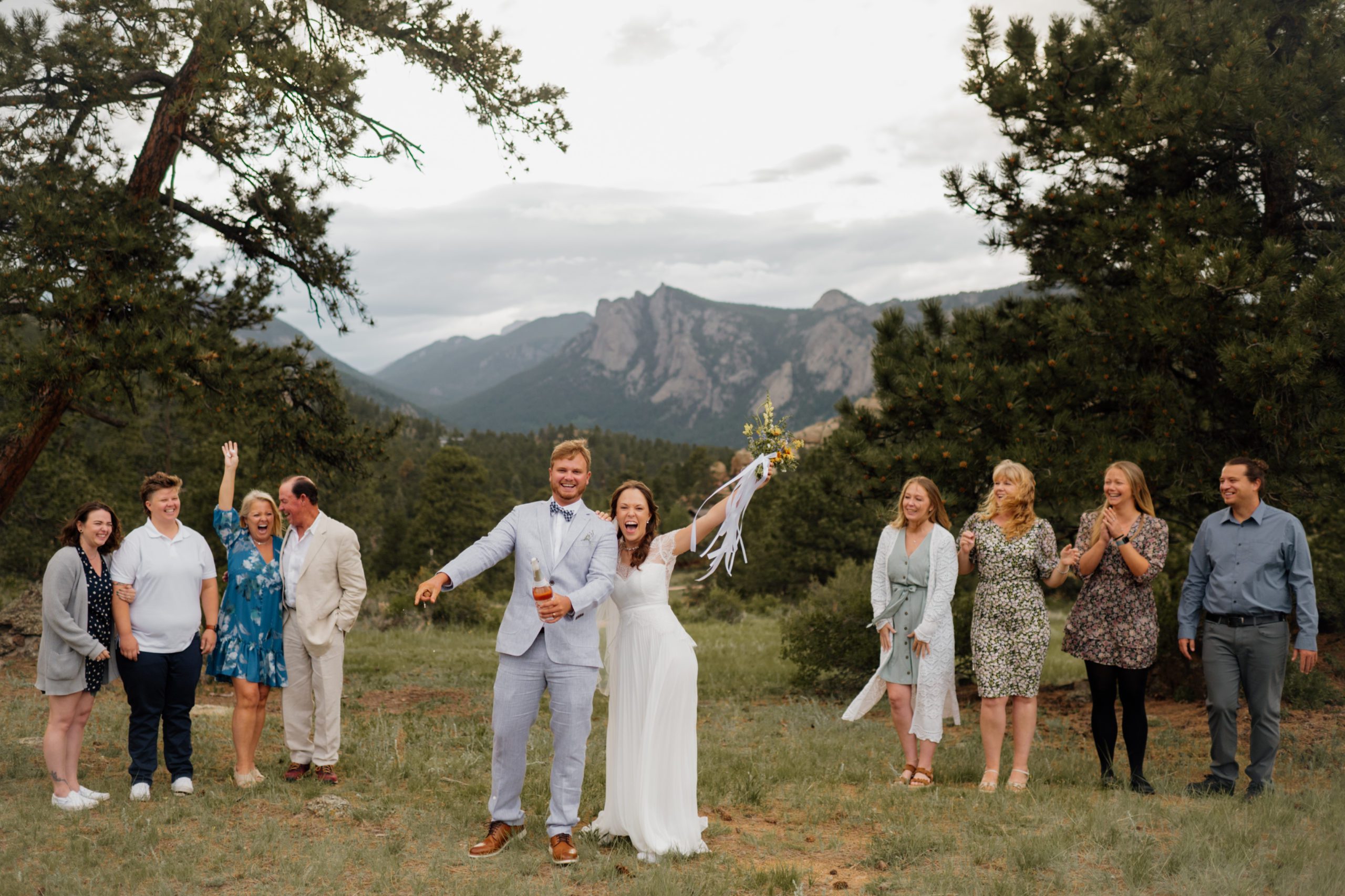 The bride and the groom celebrate after their elopement ceremony at Knoll Willows in Estes Park.