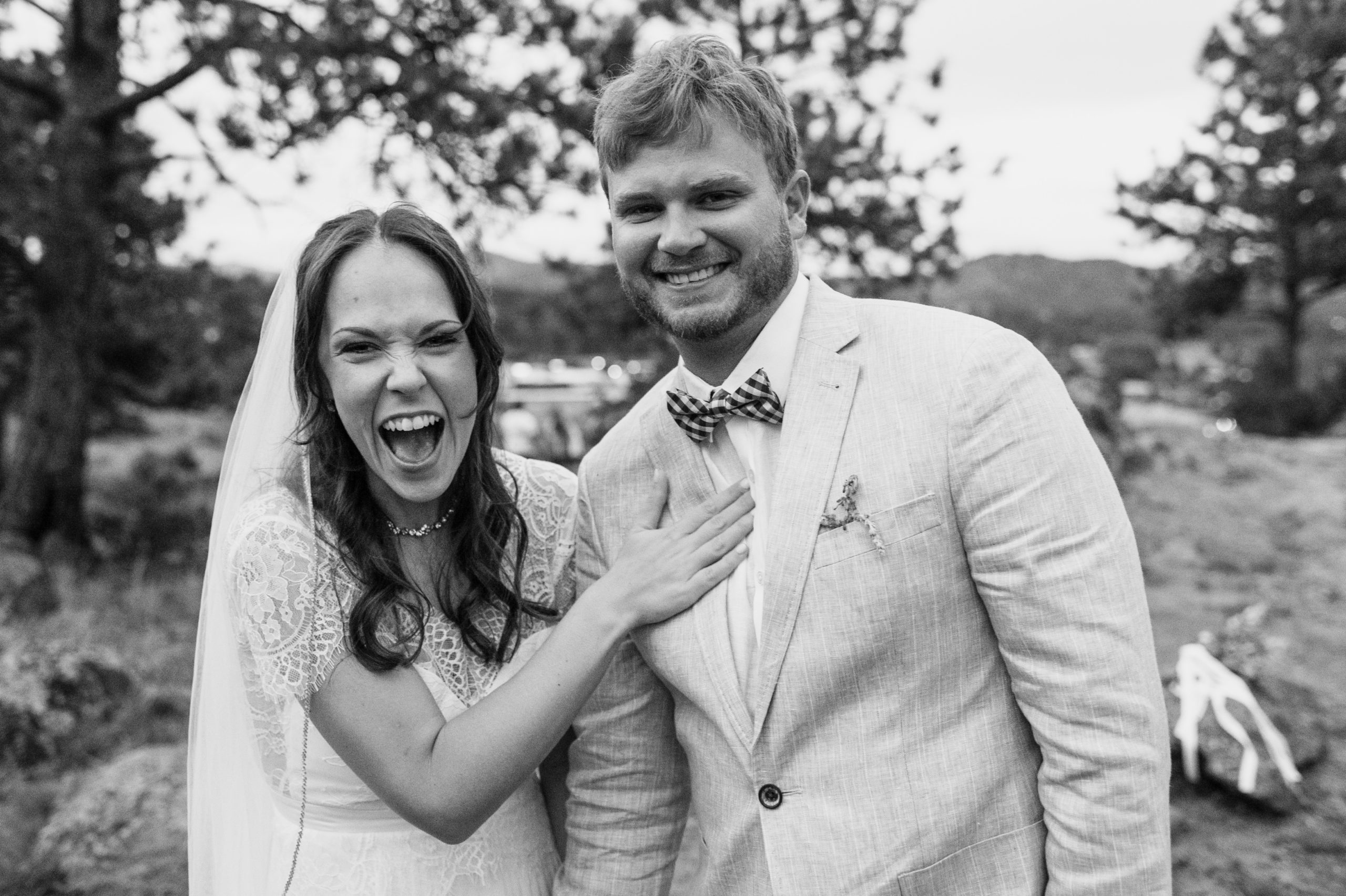A classic black and white photo of the bride and groom, both of them smiling from ear to ear in Knoll Willows.