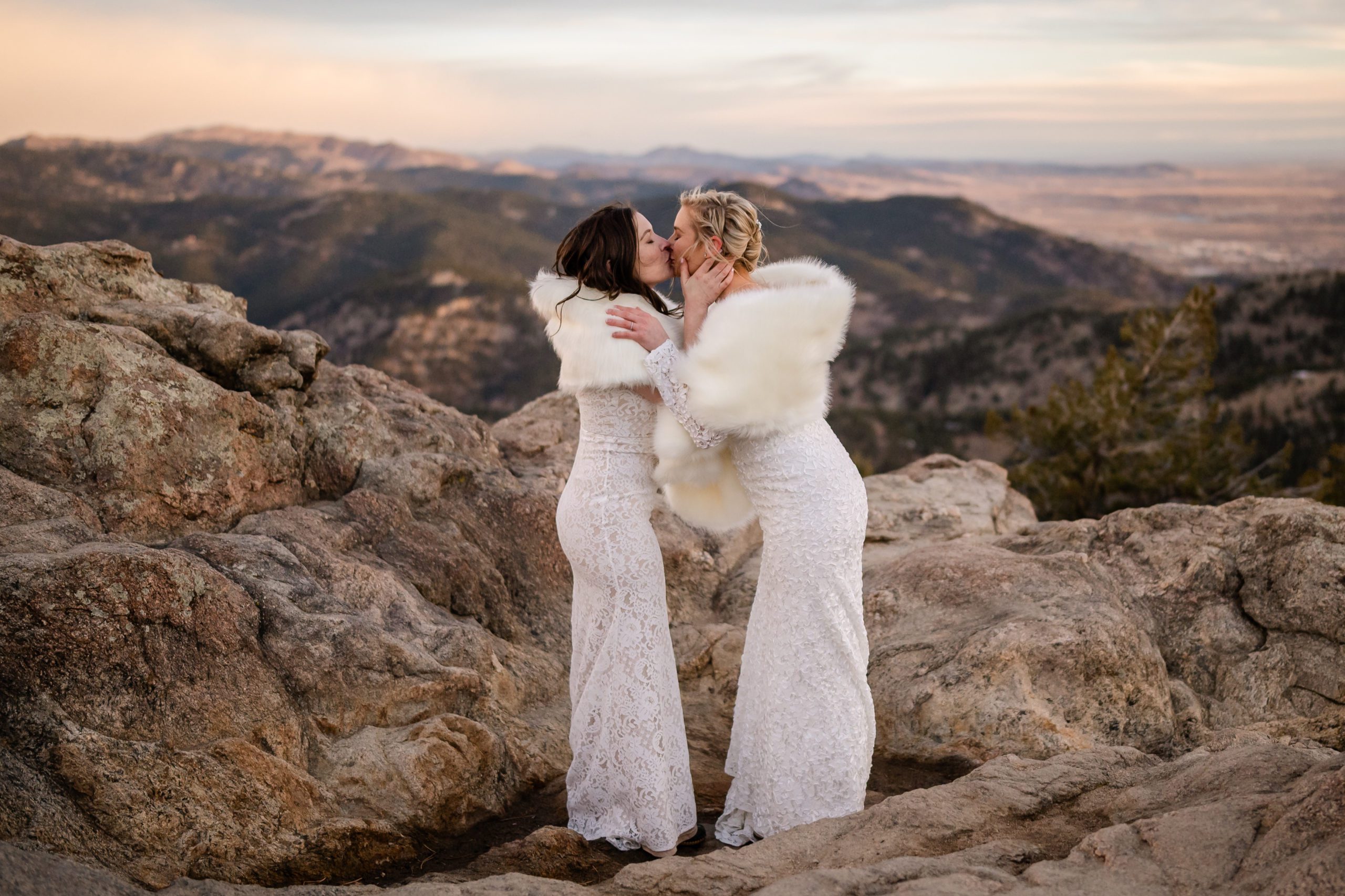 The bride's kissing at sunrise during their Lost Gulch elopement ceremony. 