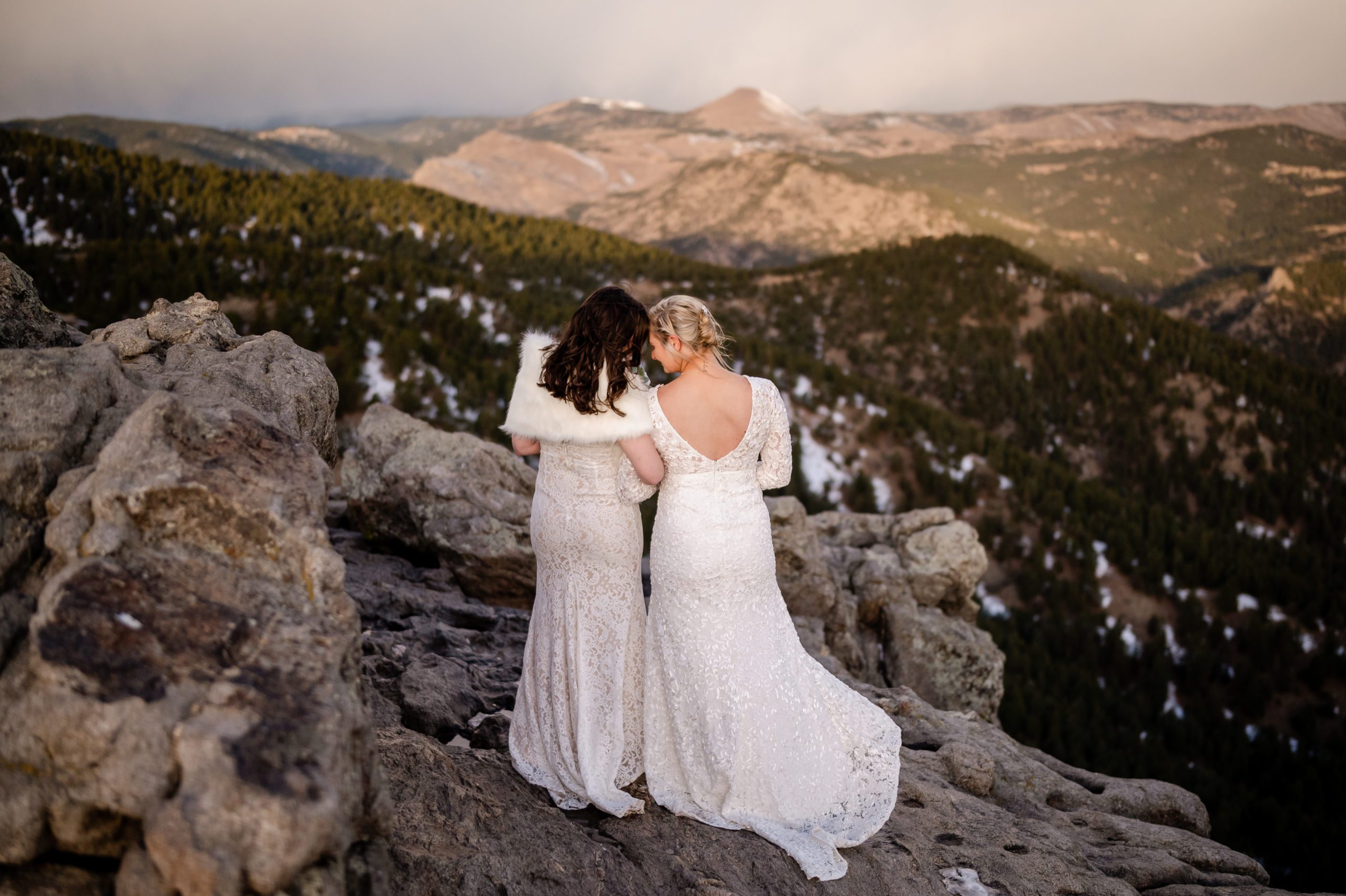 The brides facing the sunset, after their Lost Gulch elopement ceremony.