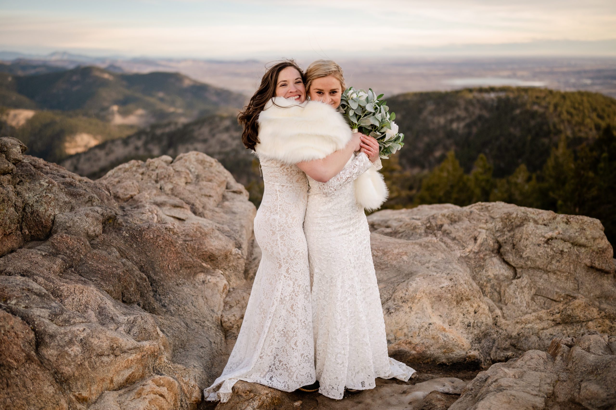The bride being cute and posing with fur shawl at their Lost Gulch elopement. 