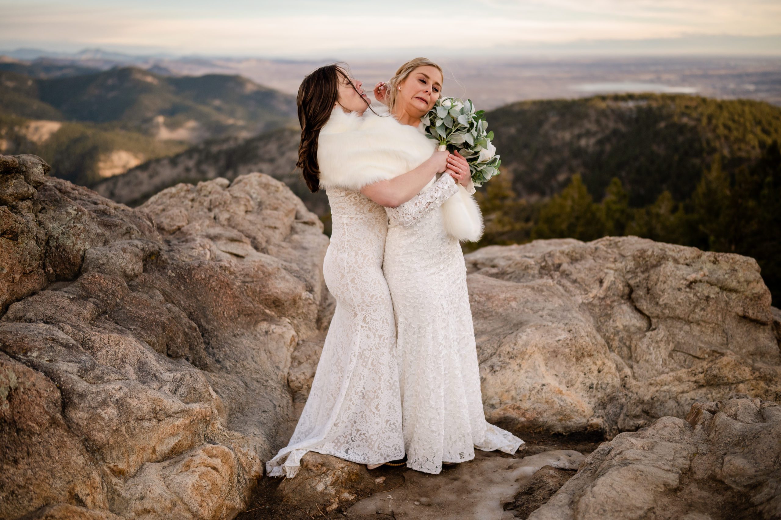 Bride's hair gets caught in her wife's hairpiece - oops. At their Lost Gulch elopement. 