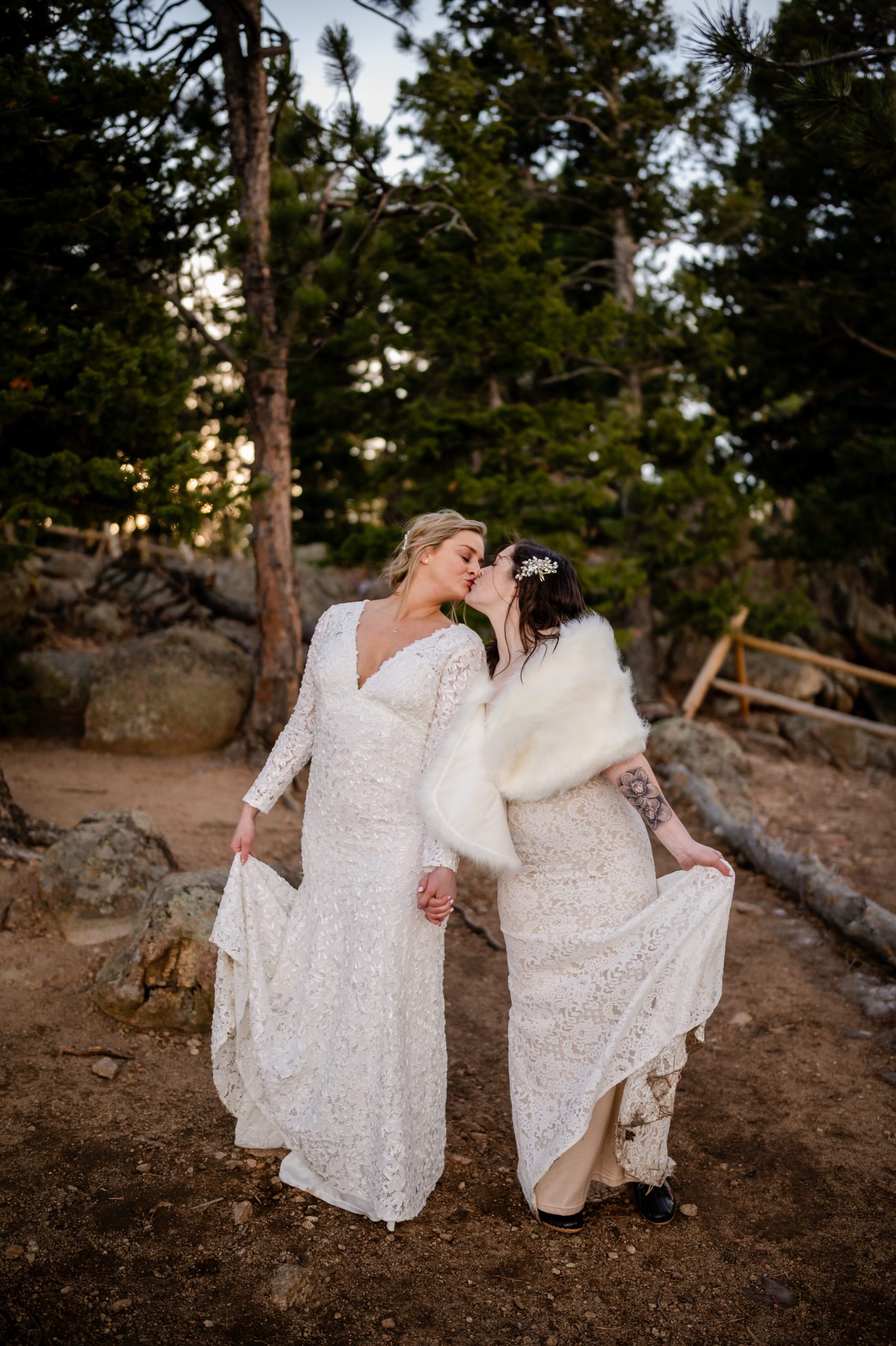 The bride's kiss holding hands during their Lost Gulch elopement. 