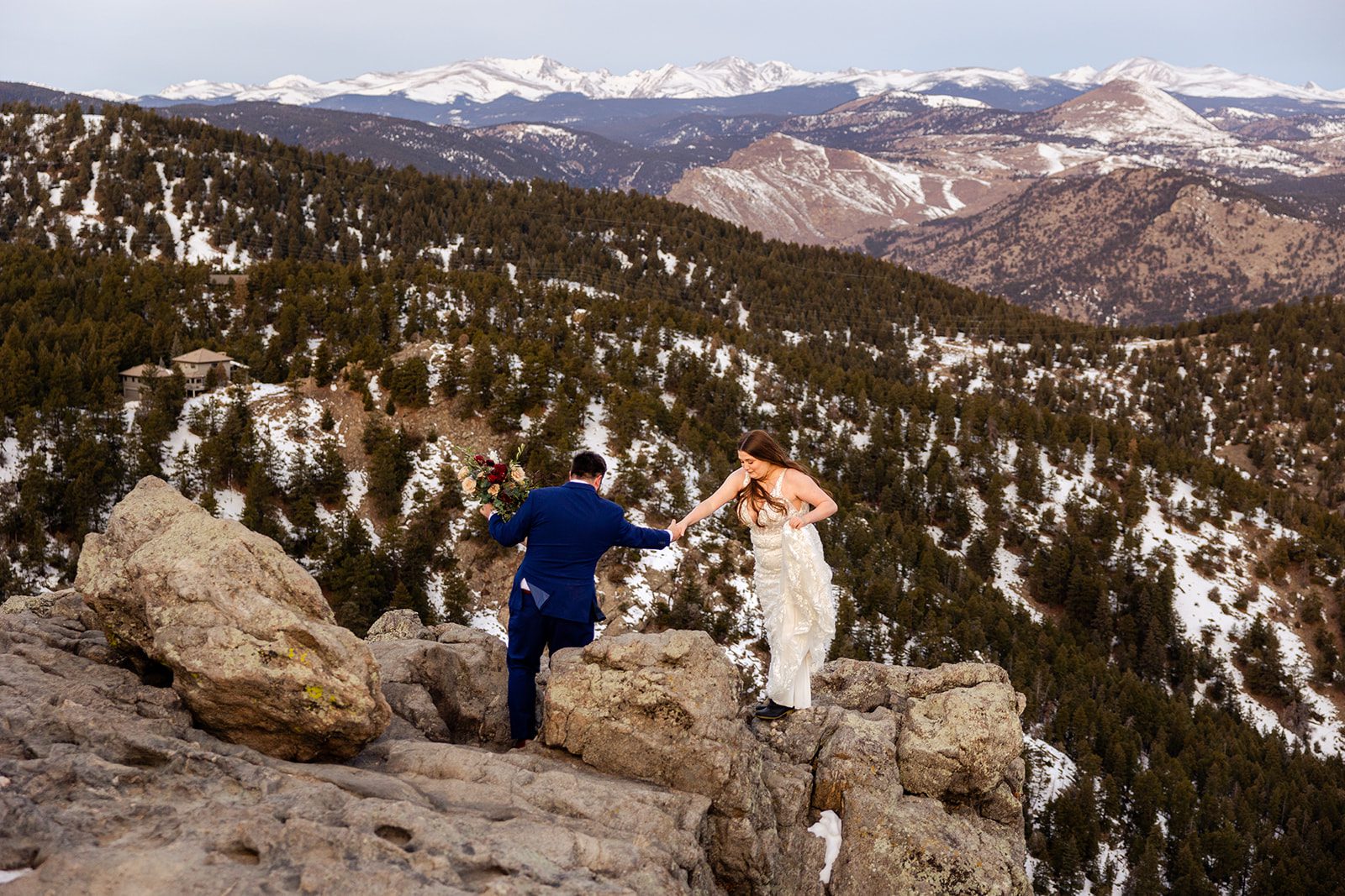 Bride and groom hiking around the mountain during their Lost Gulch elopement with  videography.