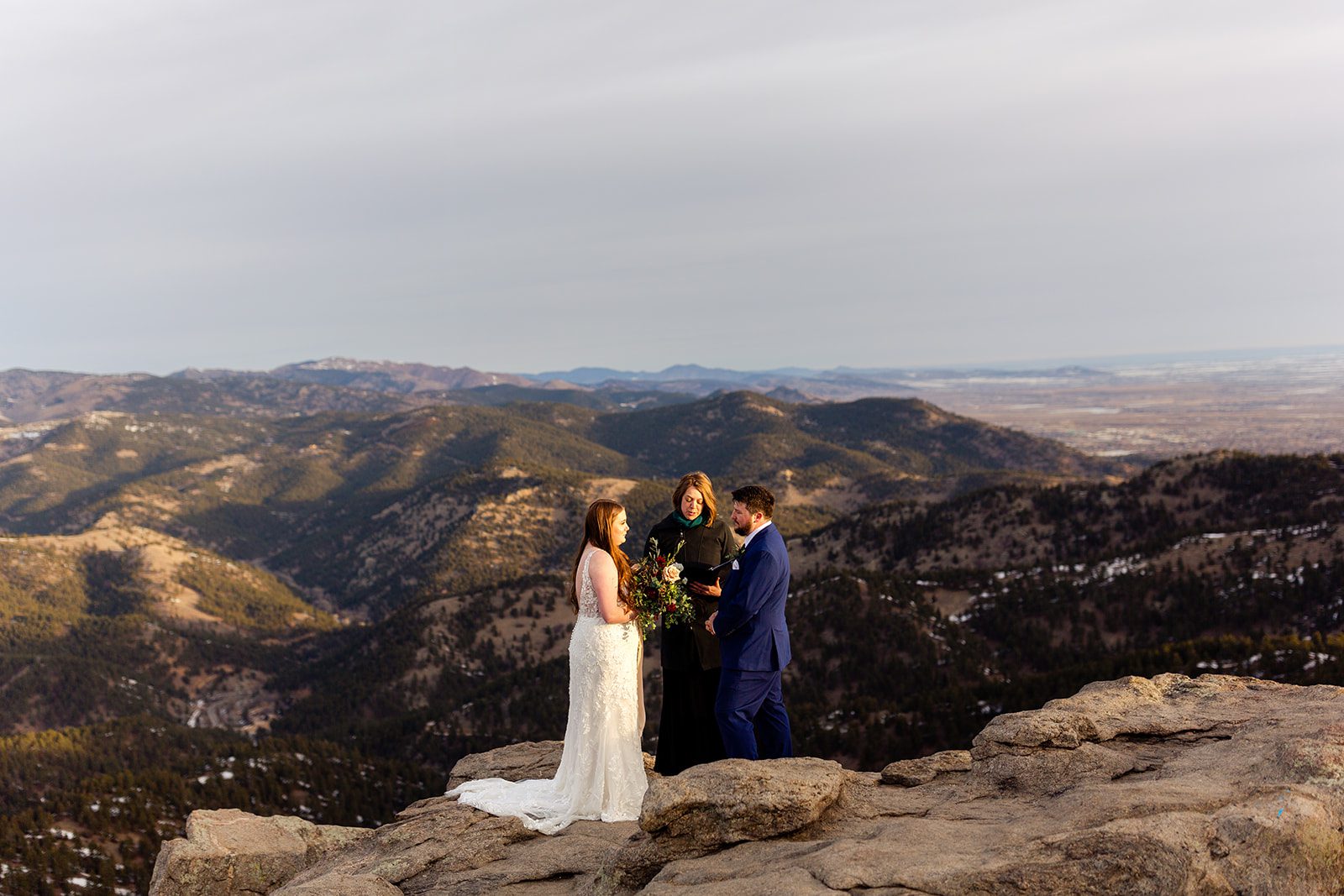 Bride and groom during their elopement ceremony at Lost Gulch with videography. 