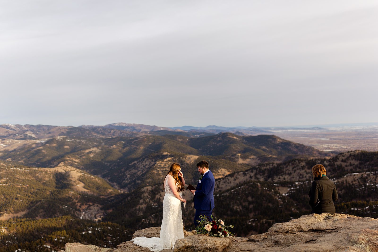 a far away shot of the bride and groom during their Lost Gulch elopement ceremony with  videography.