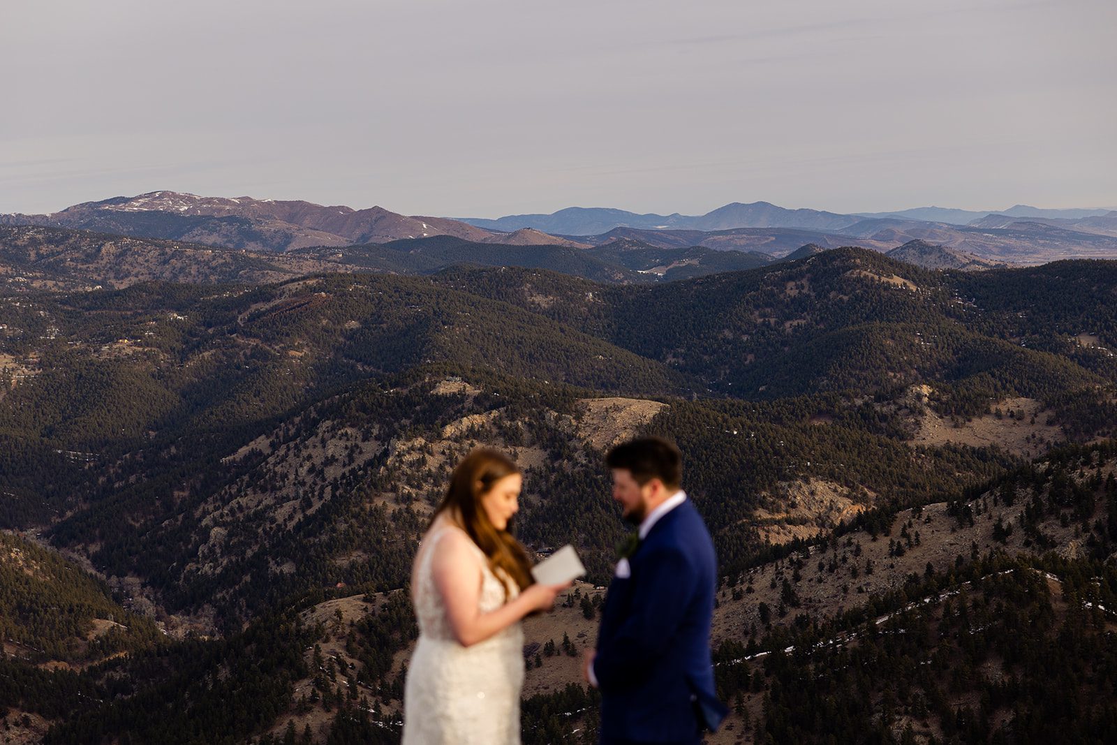 Bride reads her vows to the groom during their Lost Gulch elopement with  videography.