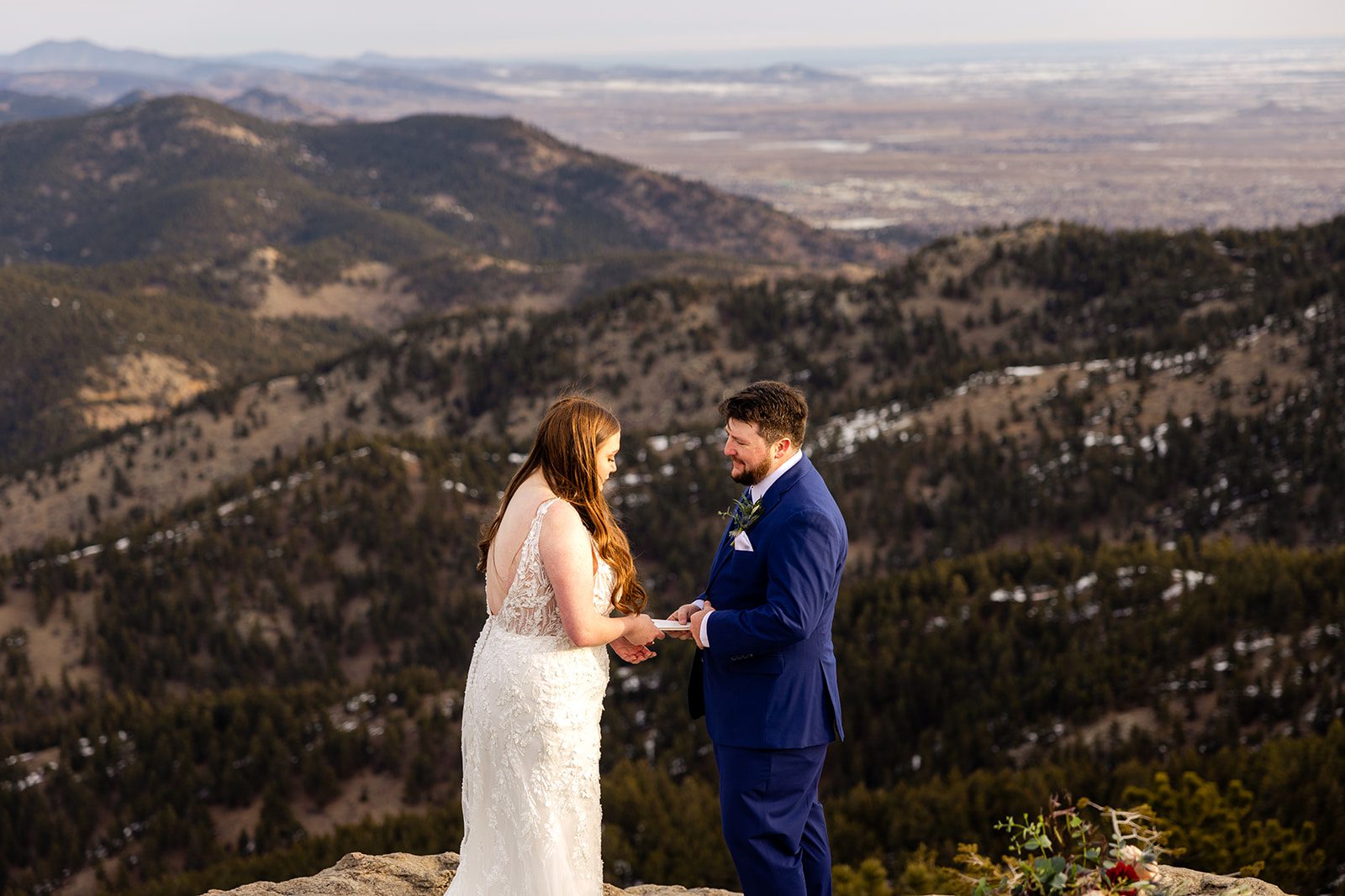 bride sharing her vows with her groom during their Lost Gulch elopement with  videography.