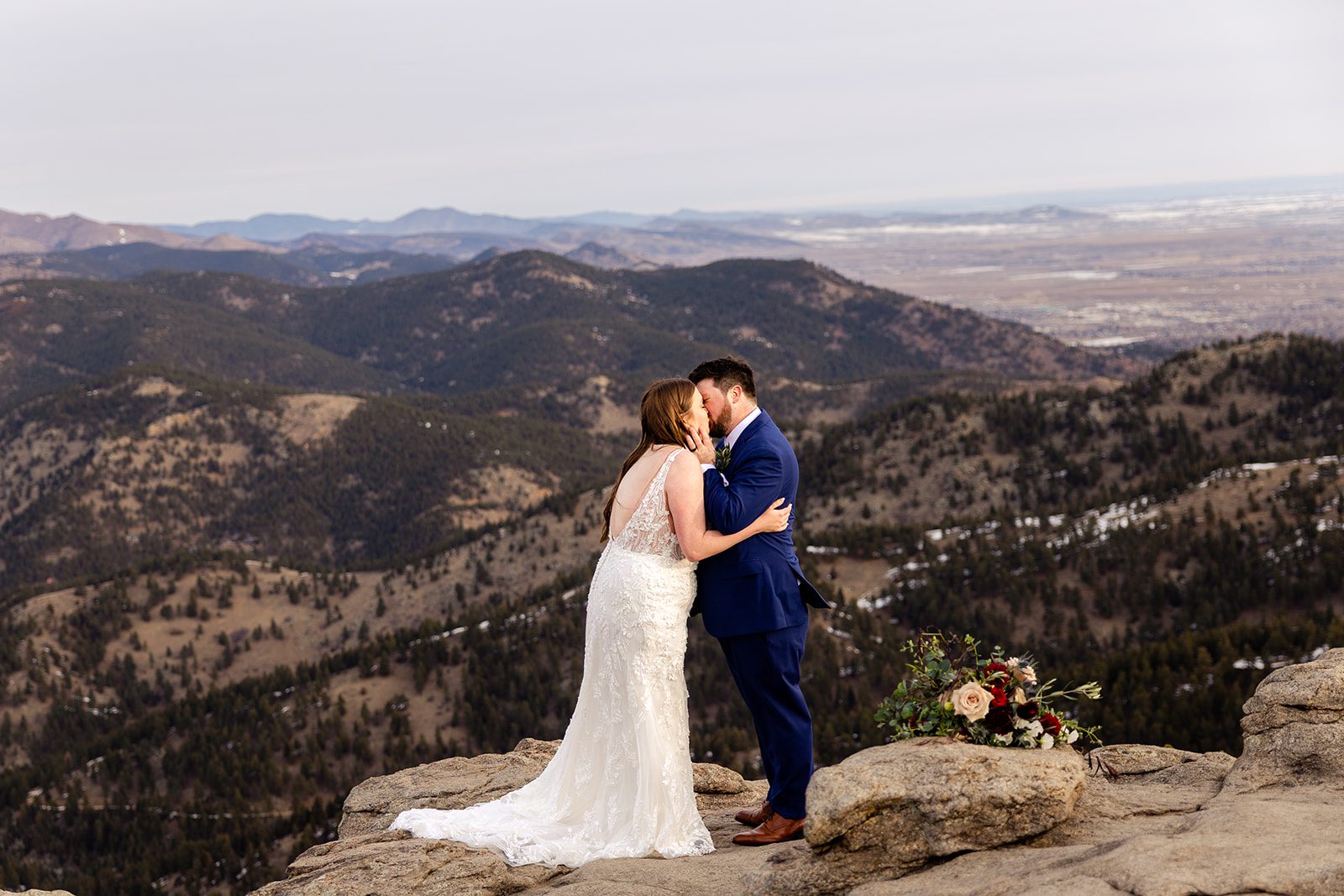 Bride and groom kiss for the first time as husband and wife during their Lost Gulch elopement with  videography.