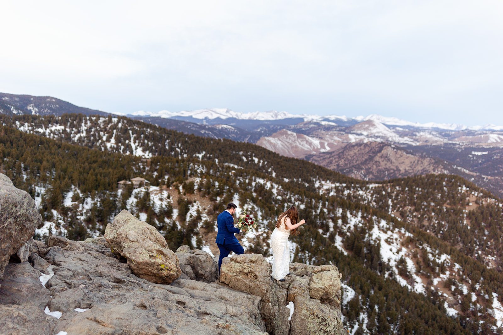 The bride and groom exploring Lost Gulch overlook during their Lost Gulch elopement with  videography.