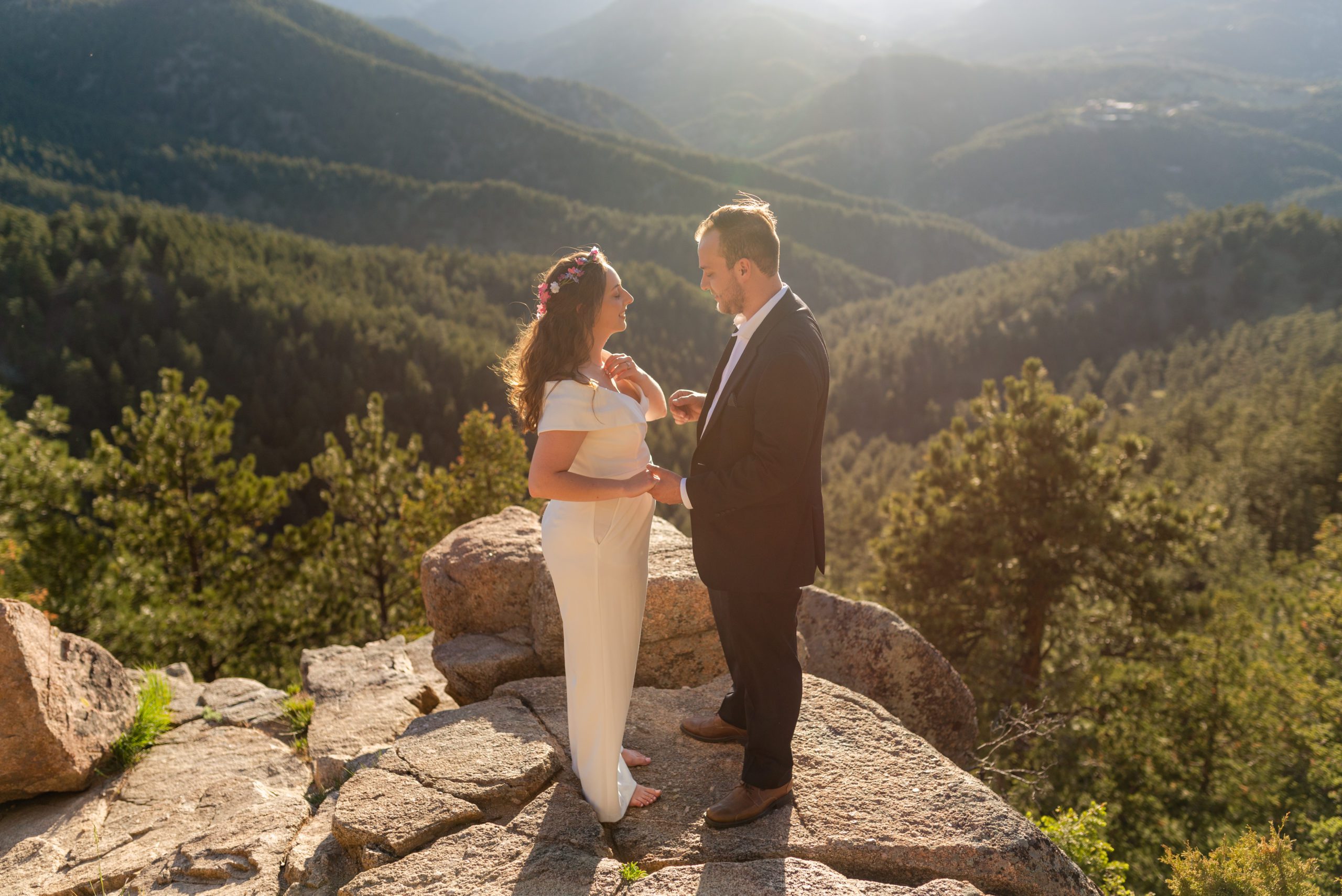 The bride and groom at the top of the overlook during their Boulder hiking elopement near realization point.