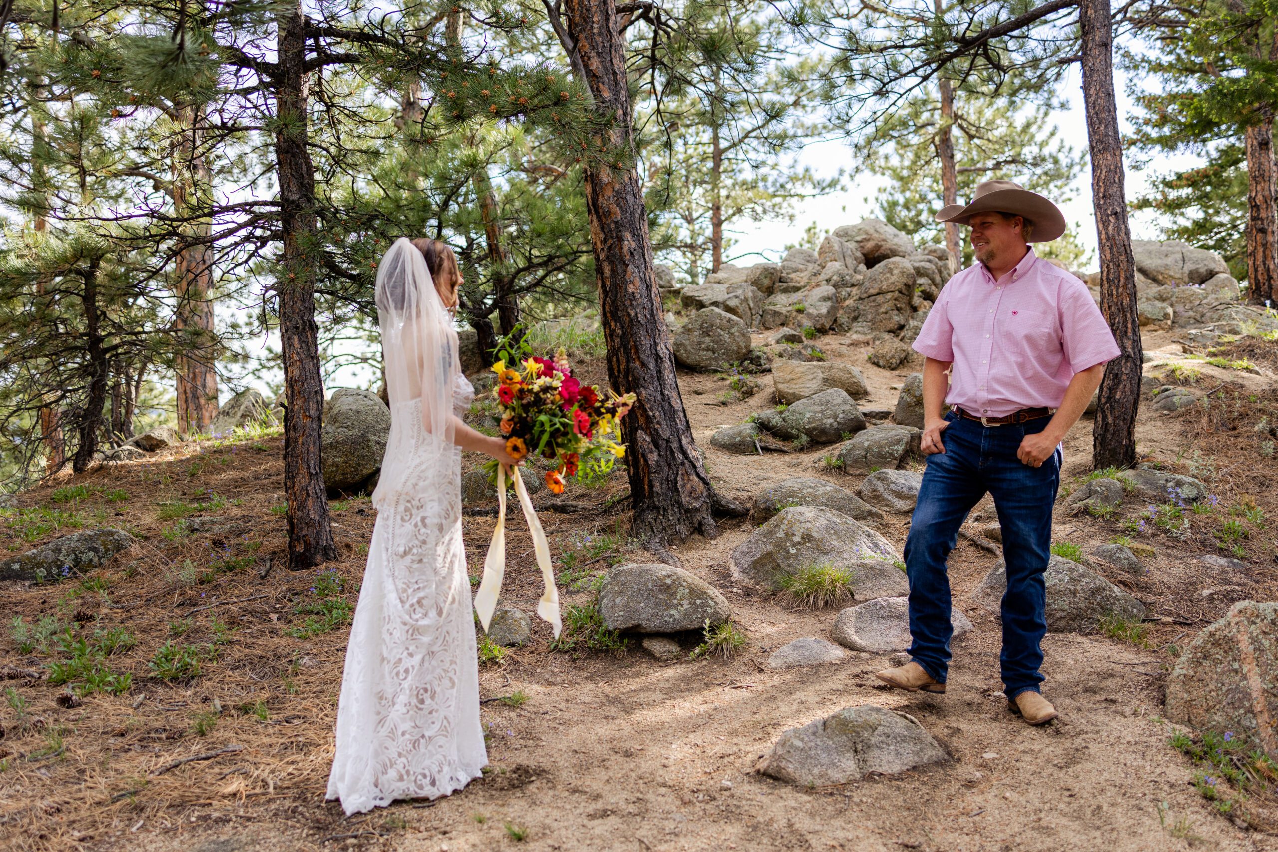 The father of the bride turns around to see his daughter for the first time on her elopement day at Sunrise Amphitheater. 