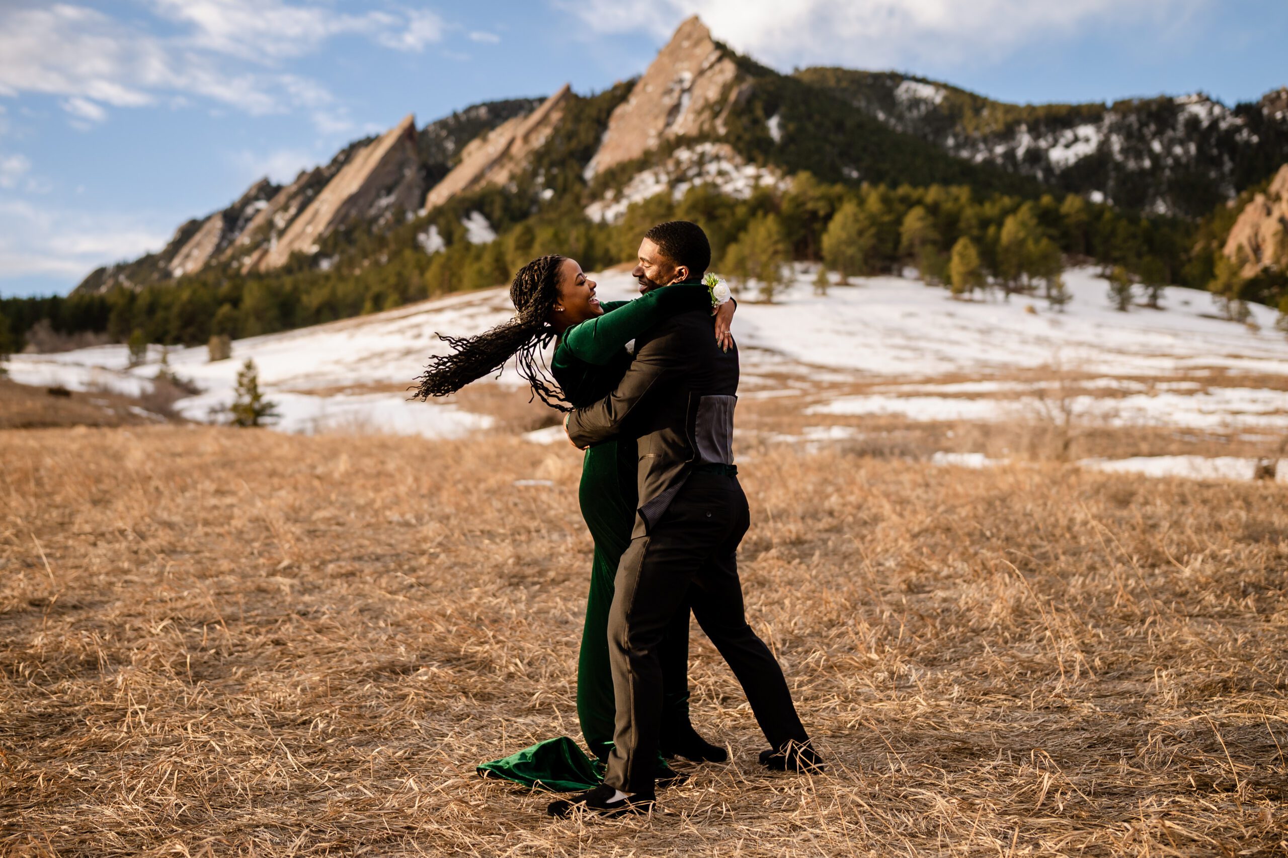 the bride and groom wrapped up in each other's arms after their Chautauqua Trail elopement. 