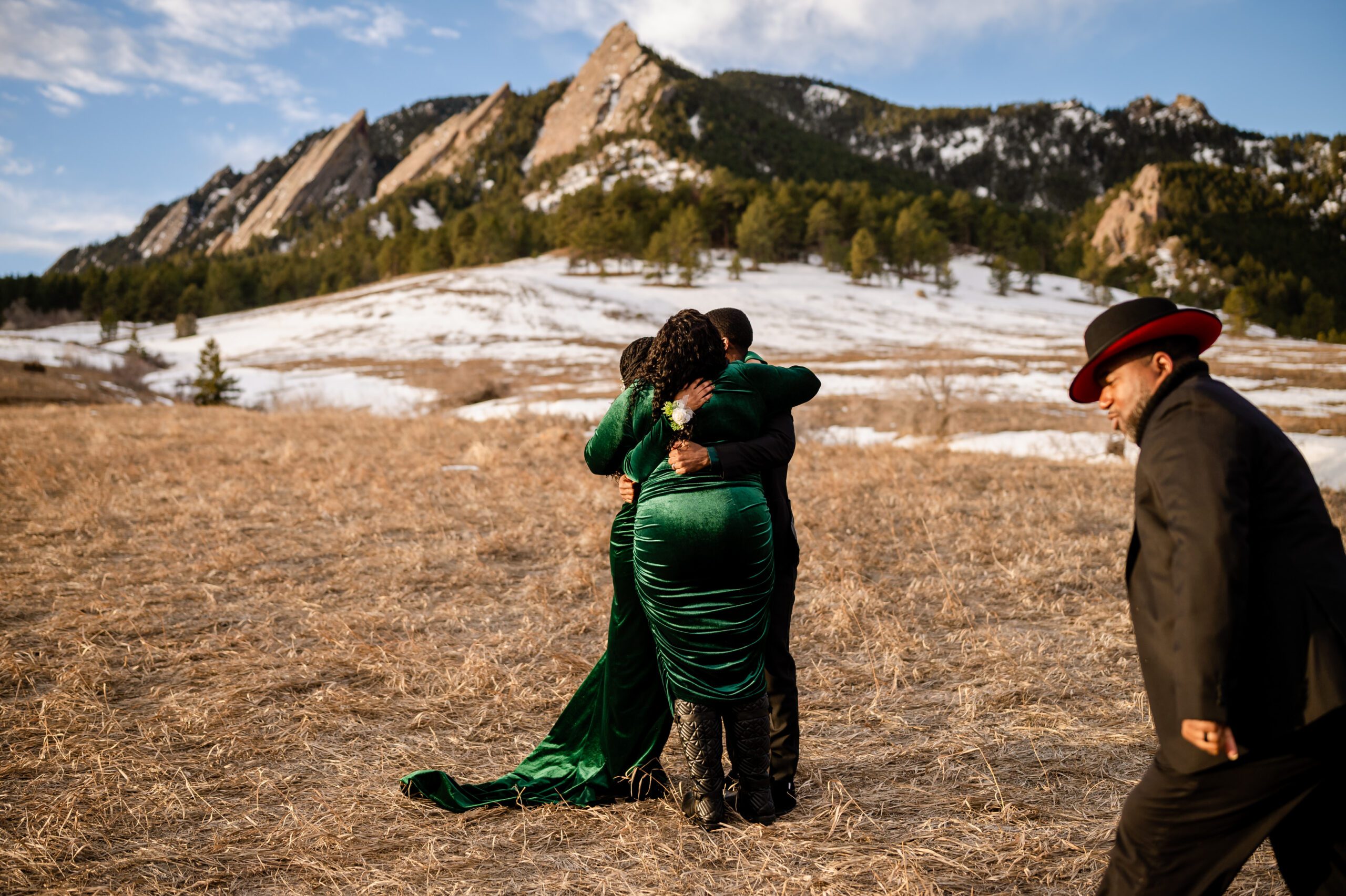 the bride and groom hugging the officant after their Chautauqua Trail elopement ceremony. 