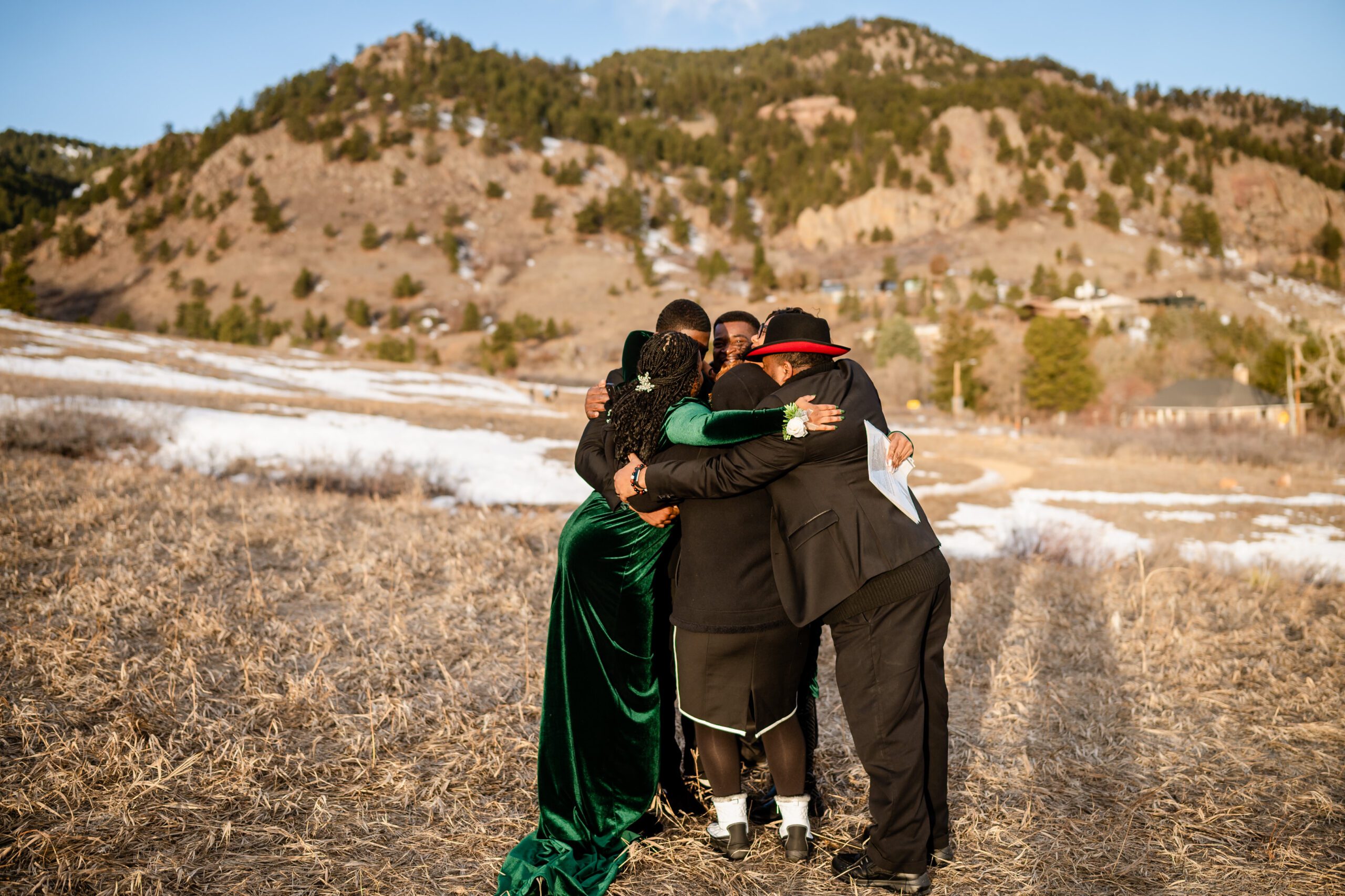 the families join together for a big group hug after the Chautauqua Trail elopement. 