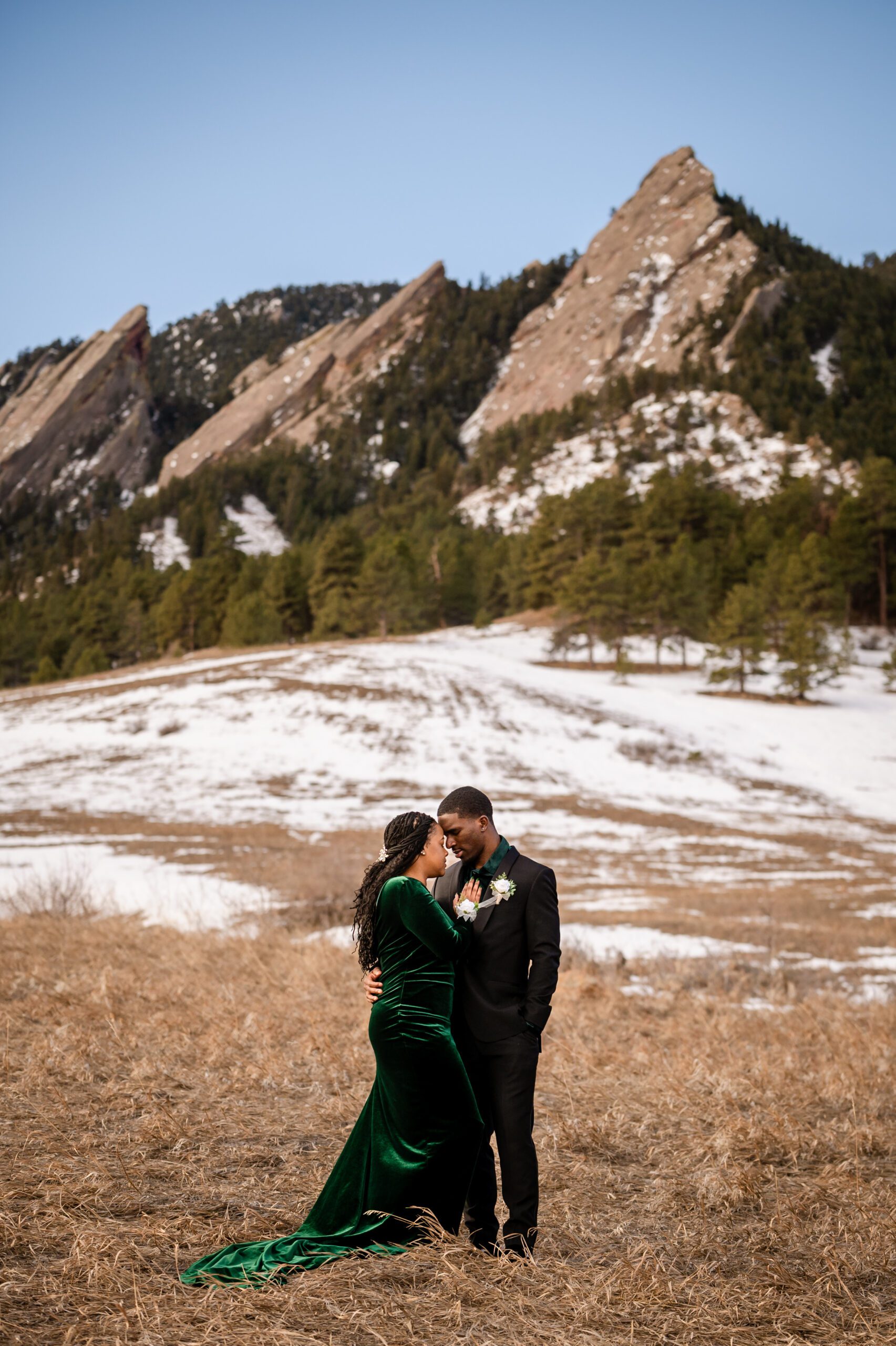bride and groom cuddled up close at their Chautauqua Trail elopement. 