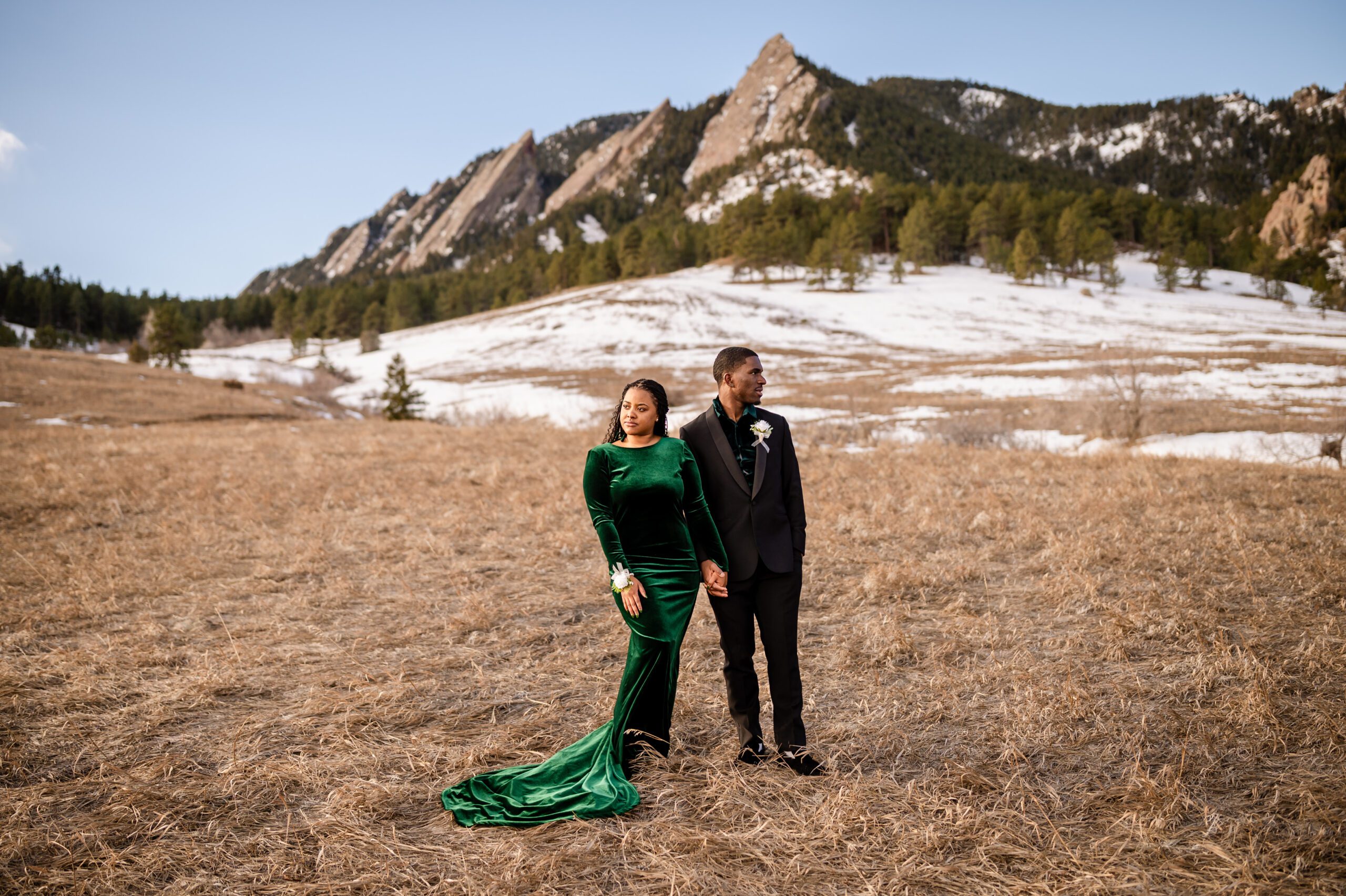 bride and groom look in opposite directions on the mountain, at their Chautauqua Trail elopement.