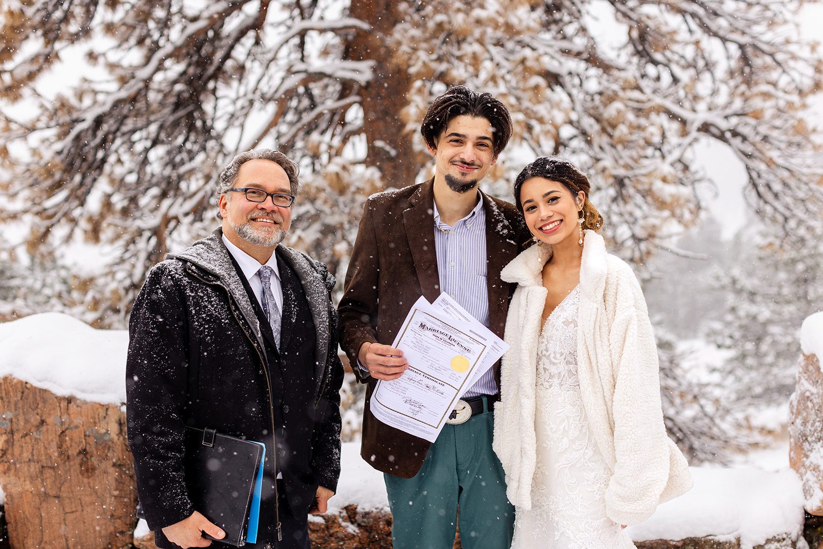 couple with their officiant the the charming Halfway house elopement