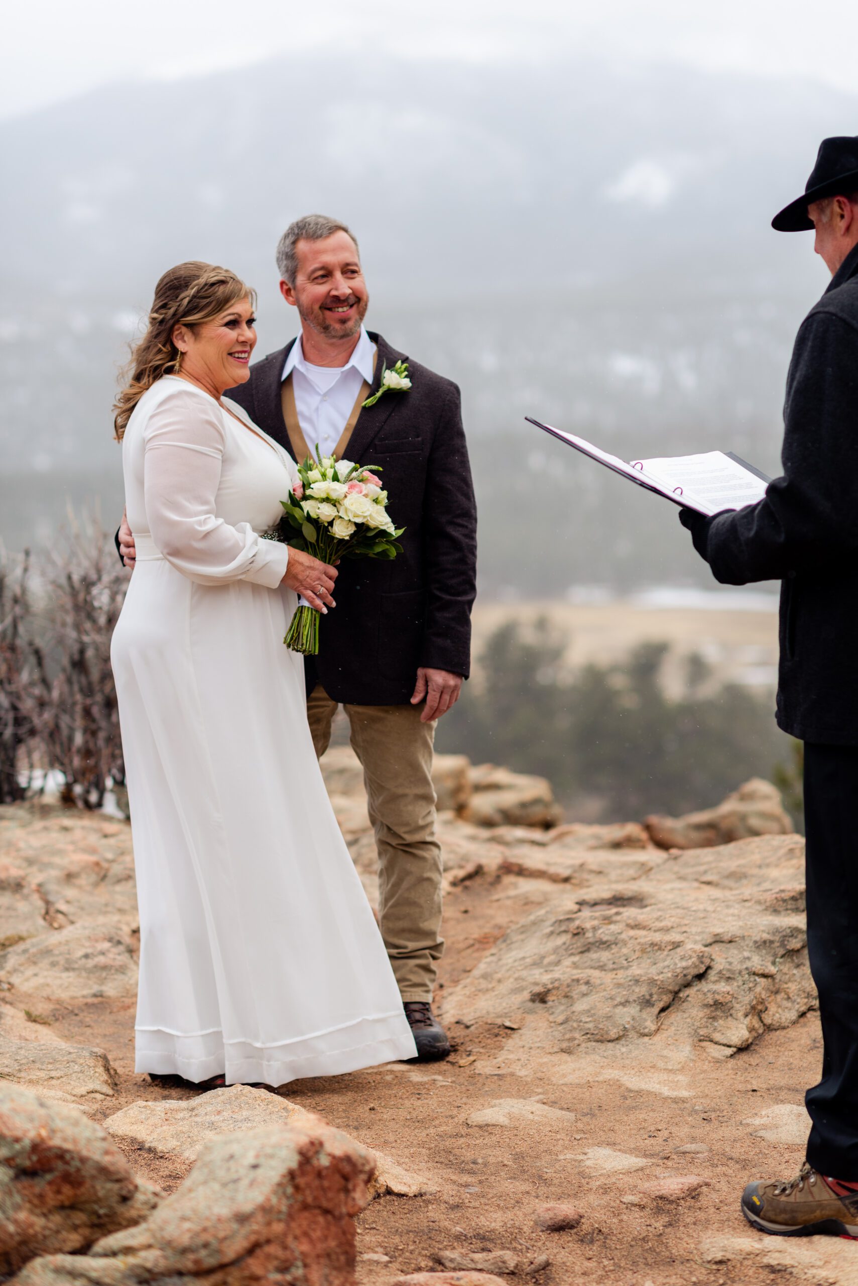 an upclose shot of the bride and groom listening to their officiant during their spring  elopement at 3M Curve.