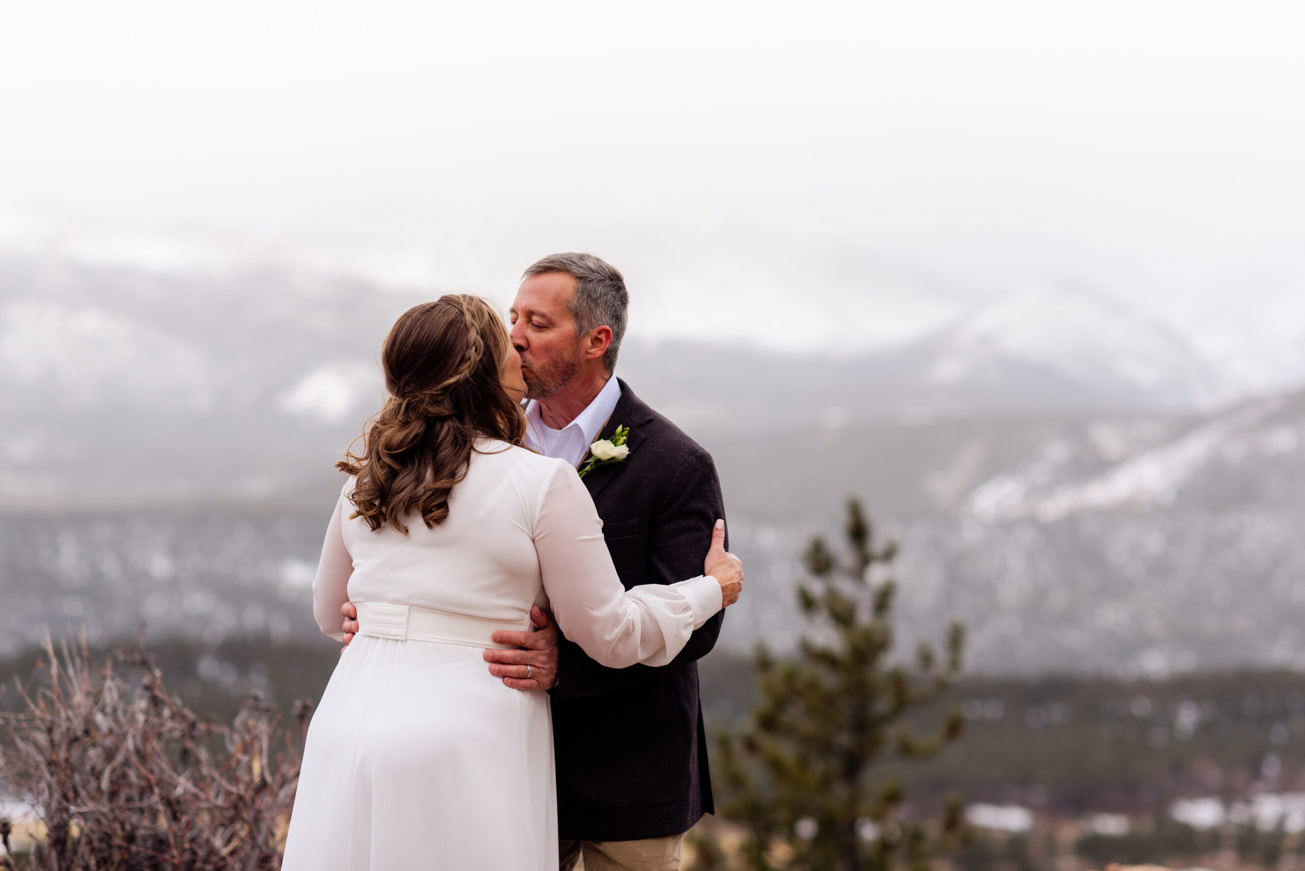 the bride and groom kiss during their spring  elopement at 3M Curve.