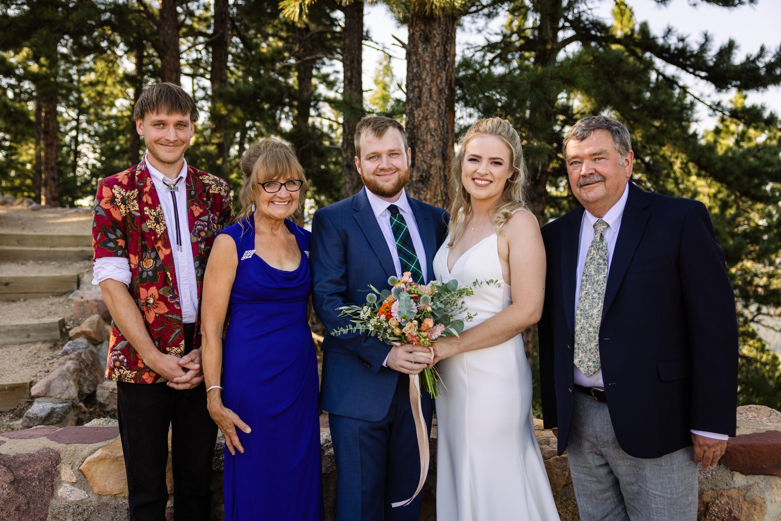 Bride and groom with groom's family at their Sunrise Amphitheater wedding.