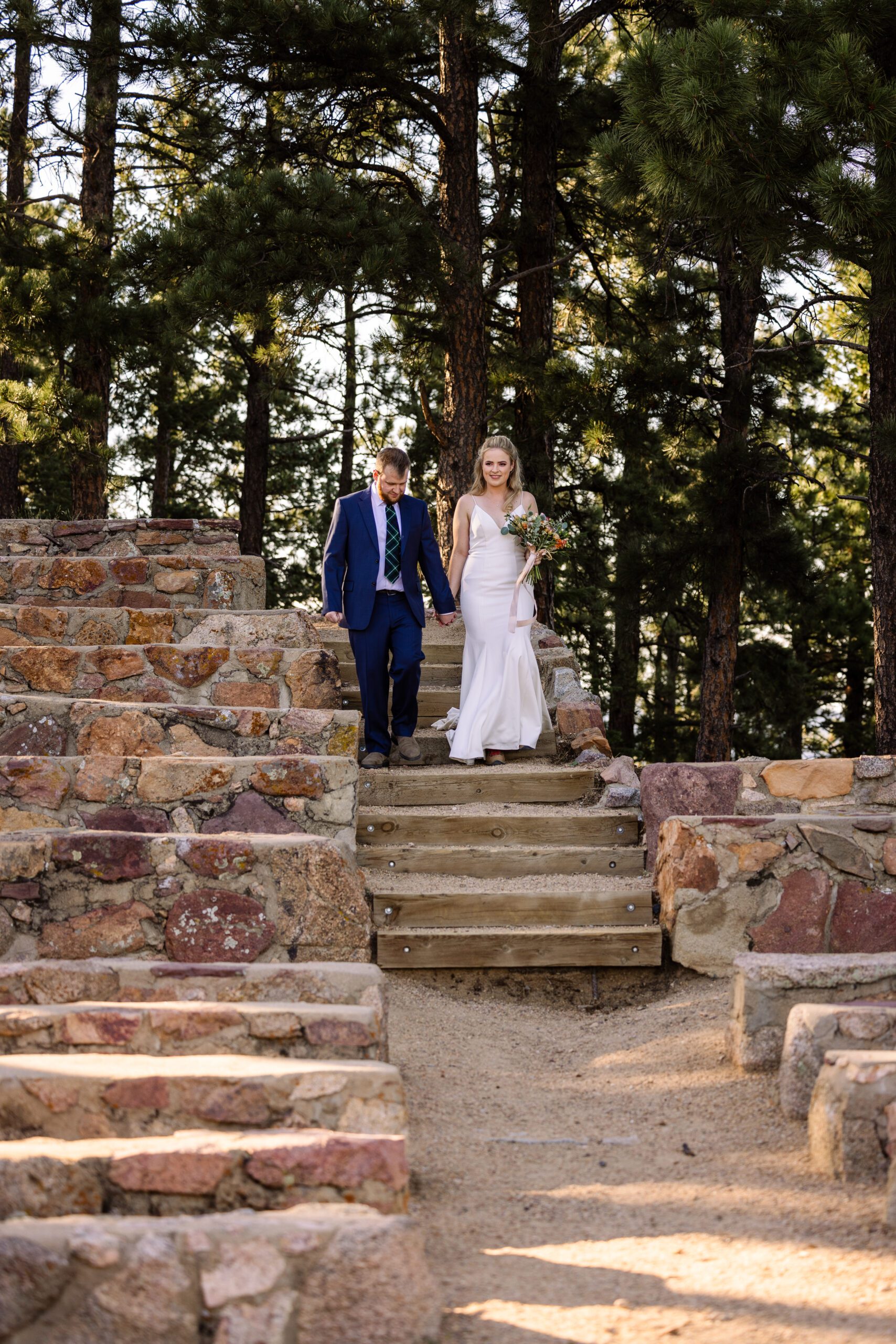 bride and groom walk down the aisle at their Sunrise Amphitheater wedding.