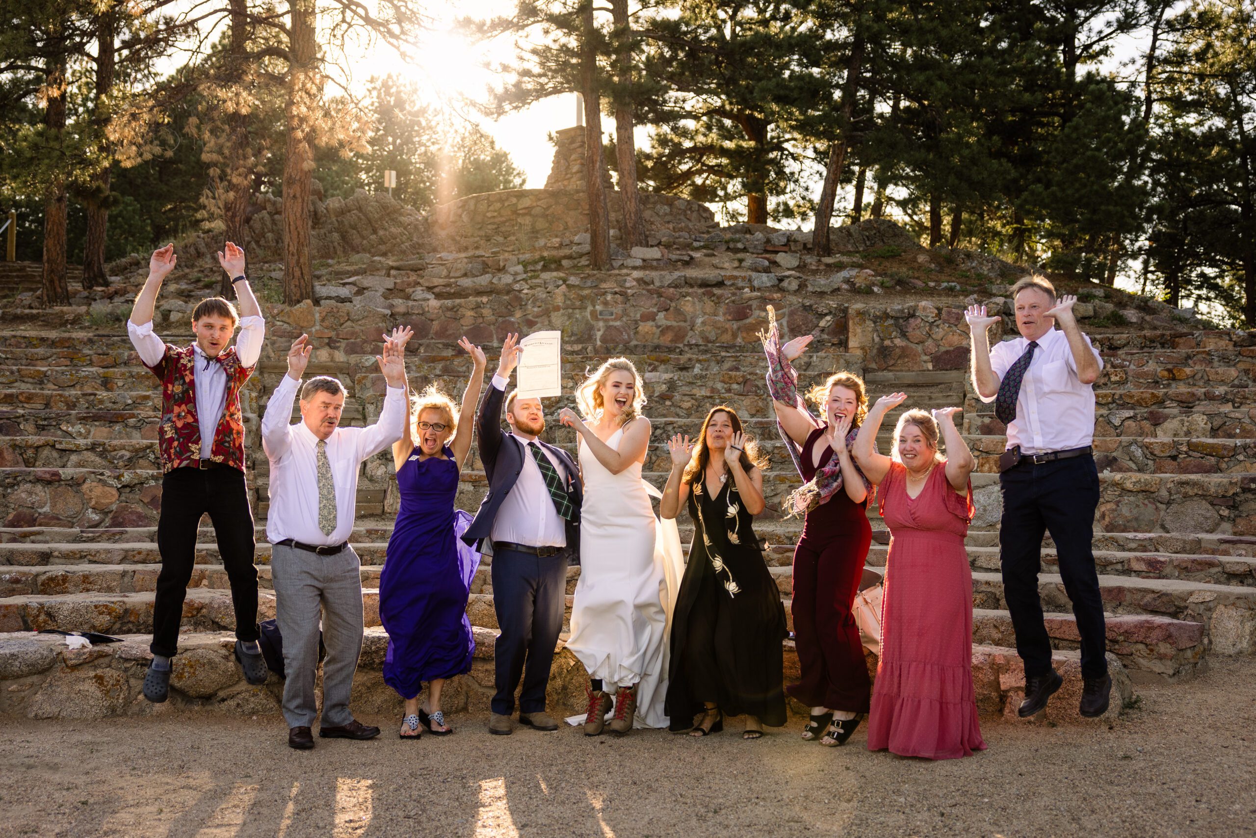 a group shot with their entire wedding party, at their Sunrise Amphitheater wedding.