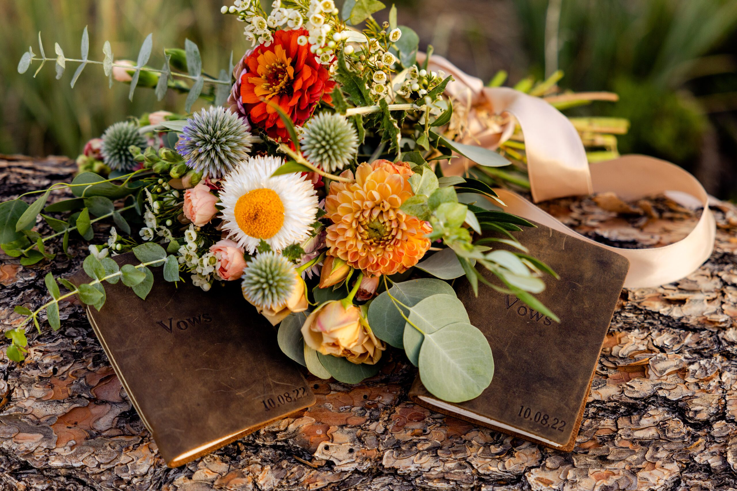 A detailed shot of the vow book at their Sunrise Amphitheater wedding.