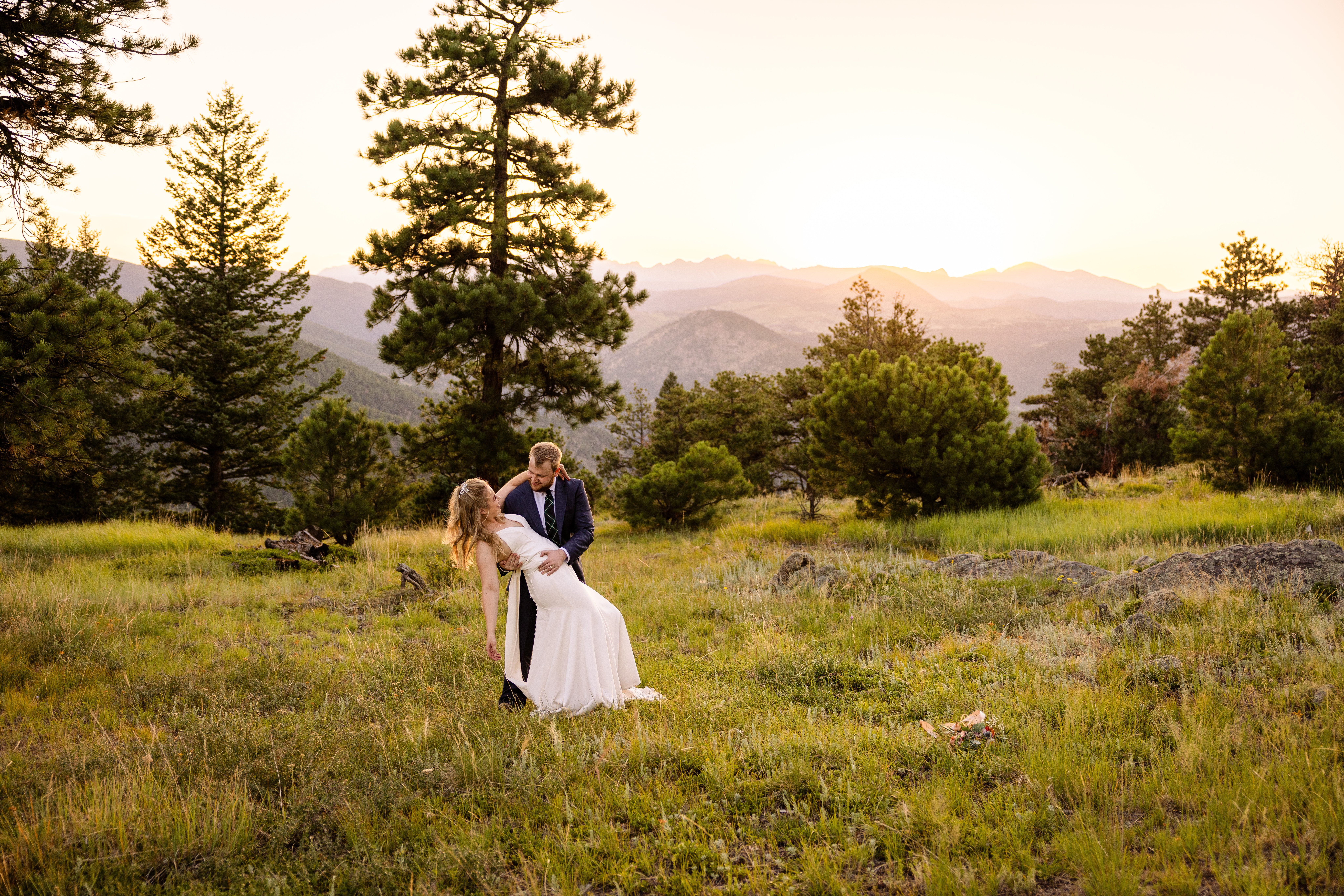 The bride and groom share a first dance at sunset after their Sunrise Amphitheater wedding.