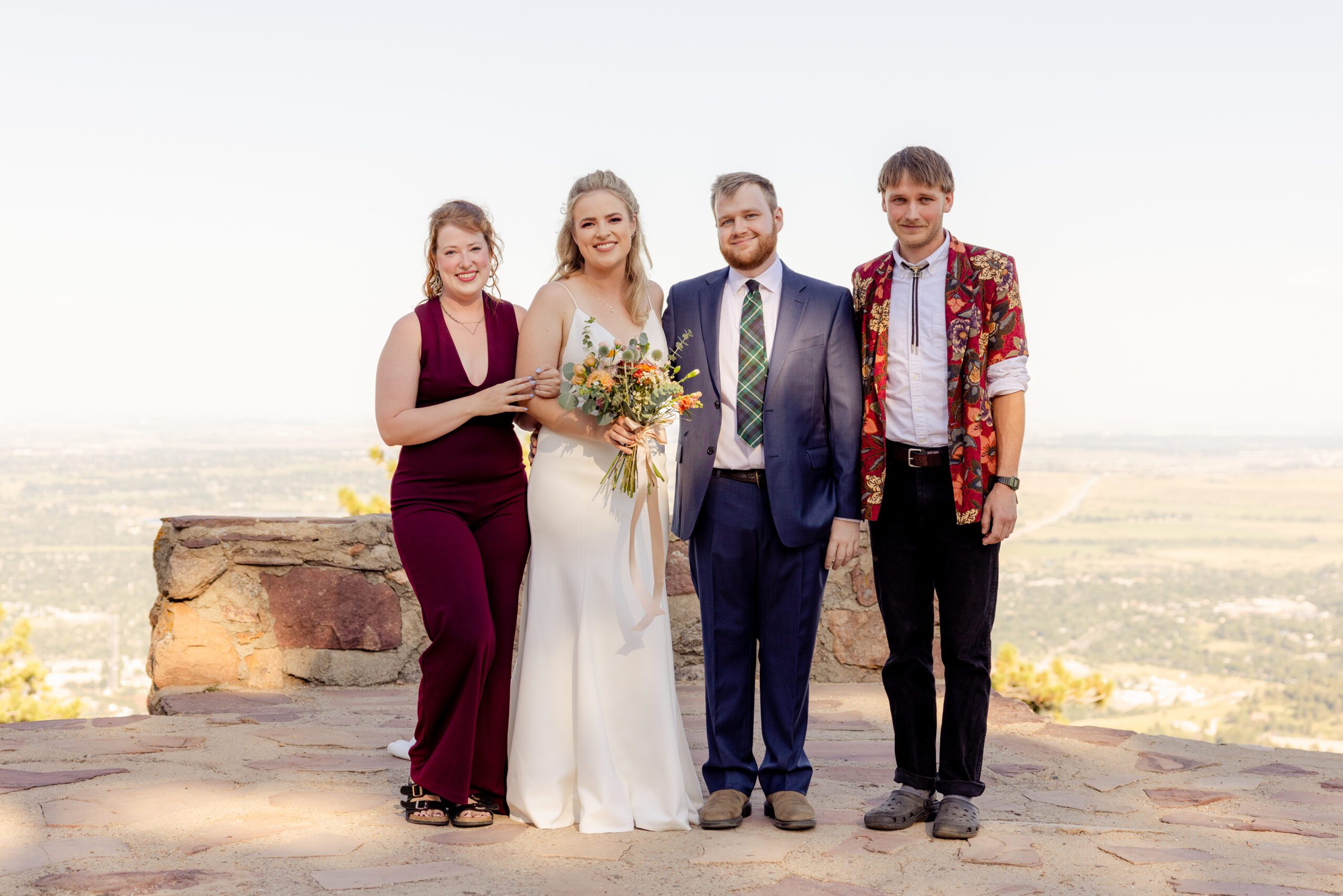 The bride and groom with their siblings after their Sunrise Amphitheater wedding.