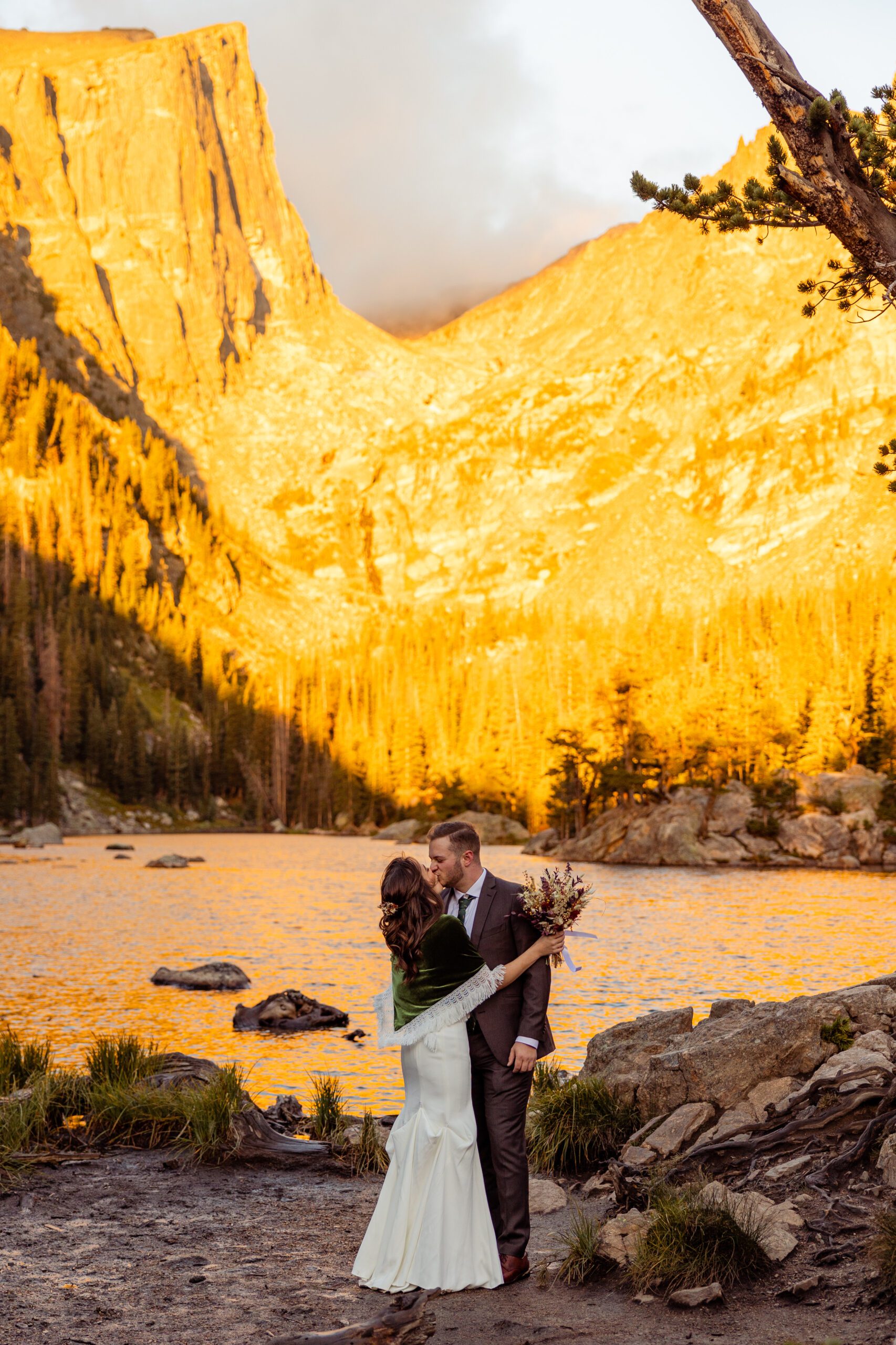 bride and groom kissing at their Dream Lake elopement. 