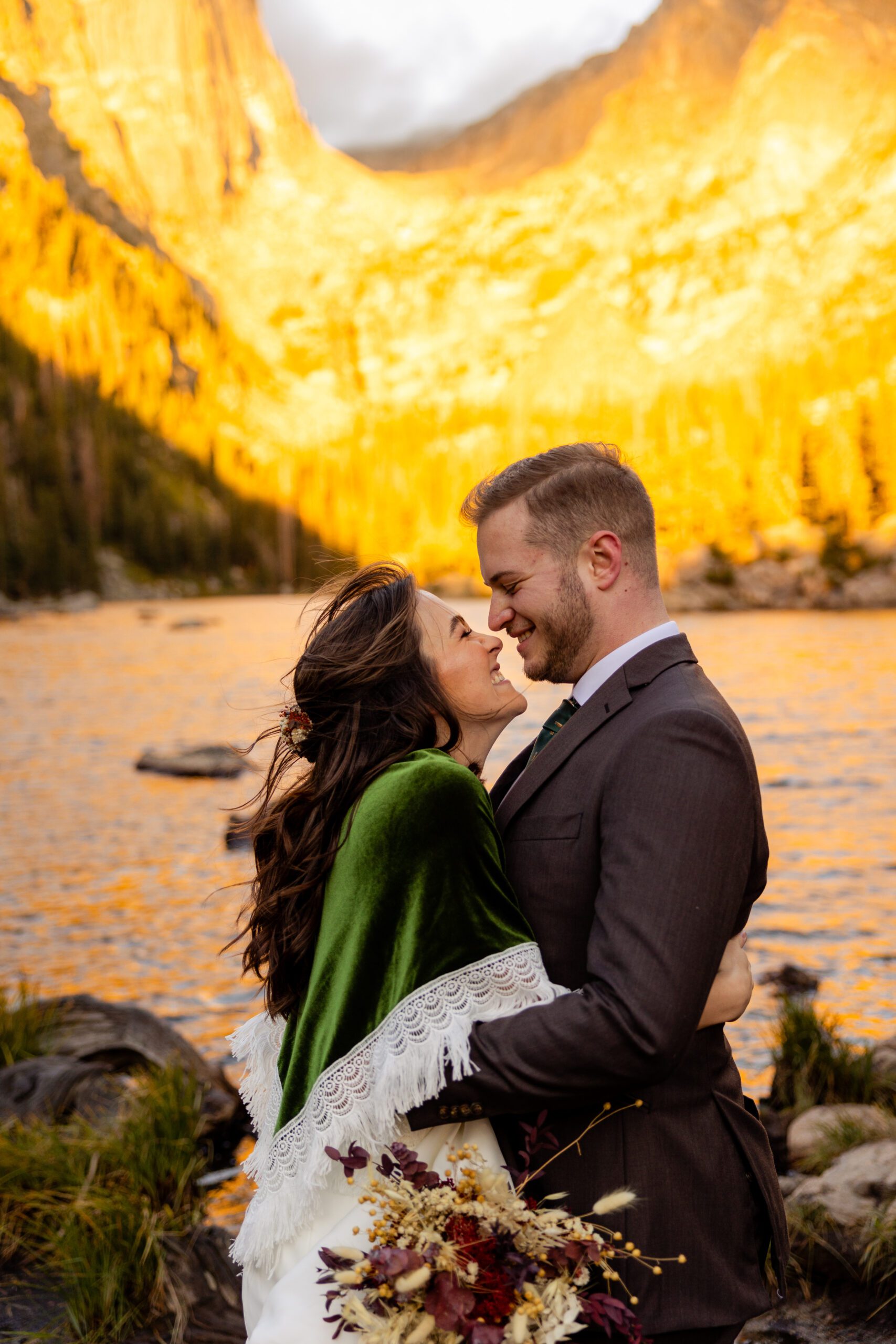 bride and groom looking at each other with giant smiles after their first look before their Dream Lake elopement. 