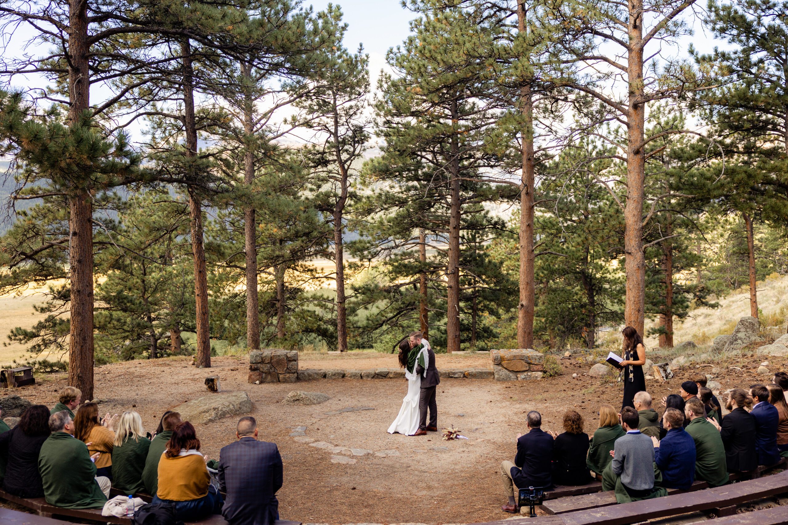 officially husband and wife, the bride and groom seal their love with a kiss at their Dream Lake elopement. 