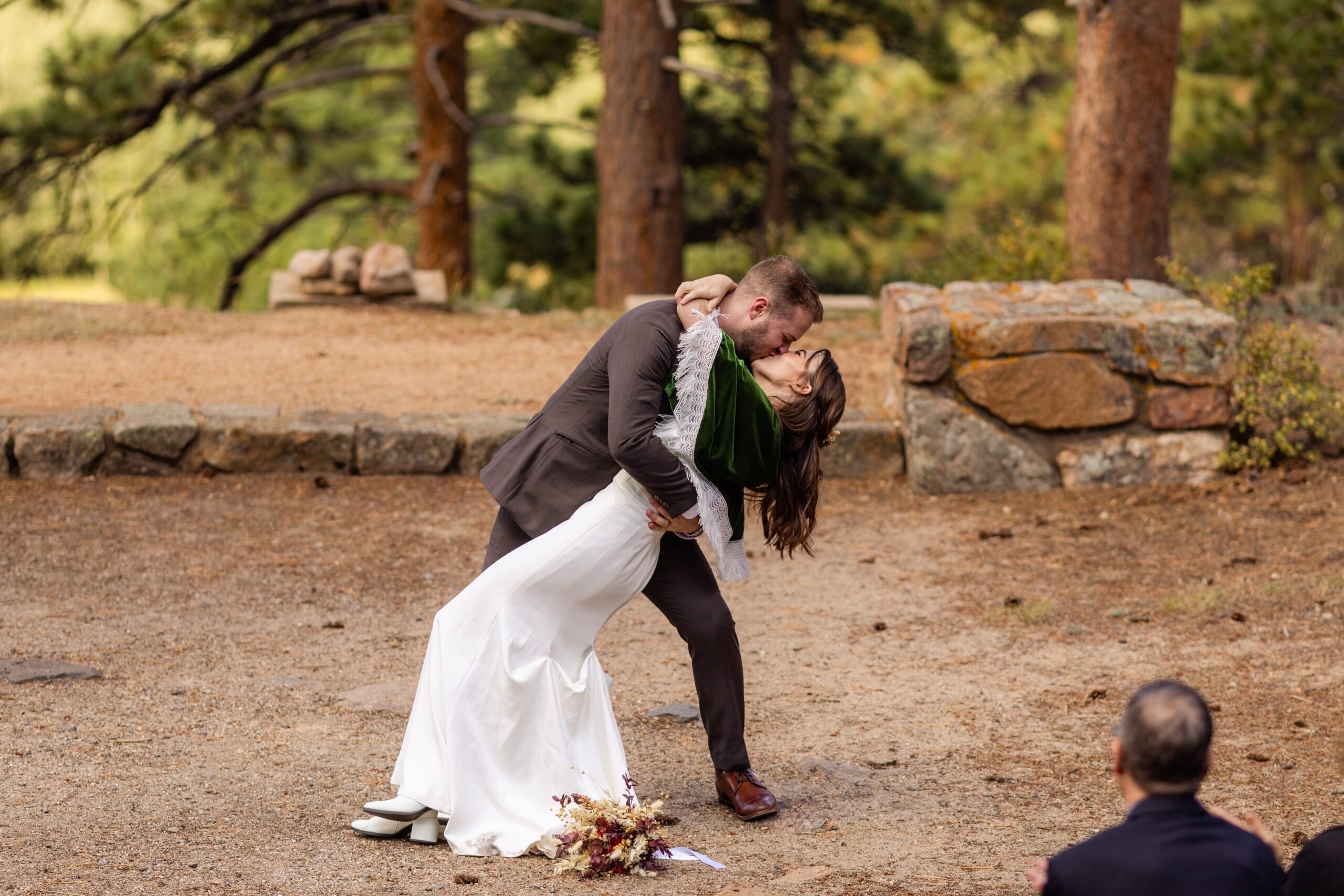 groom dips his bride down with a big kiss on their Dream Lake Elopement day! 