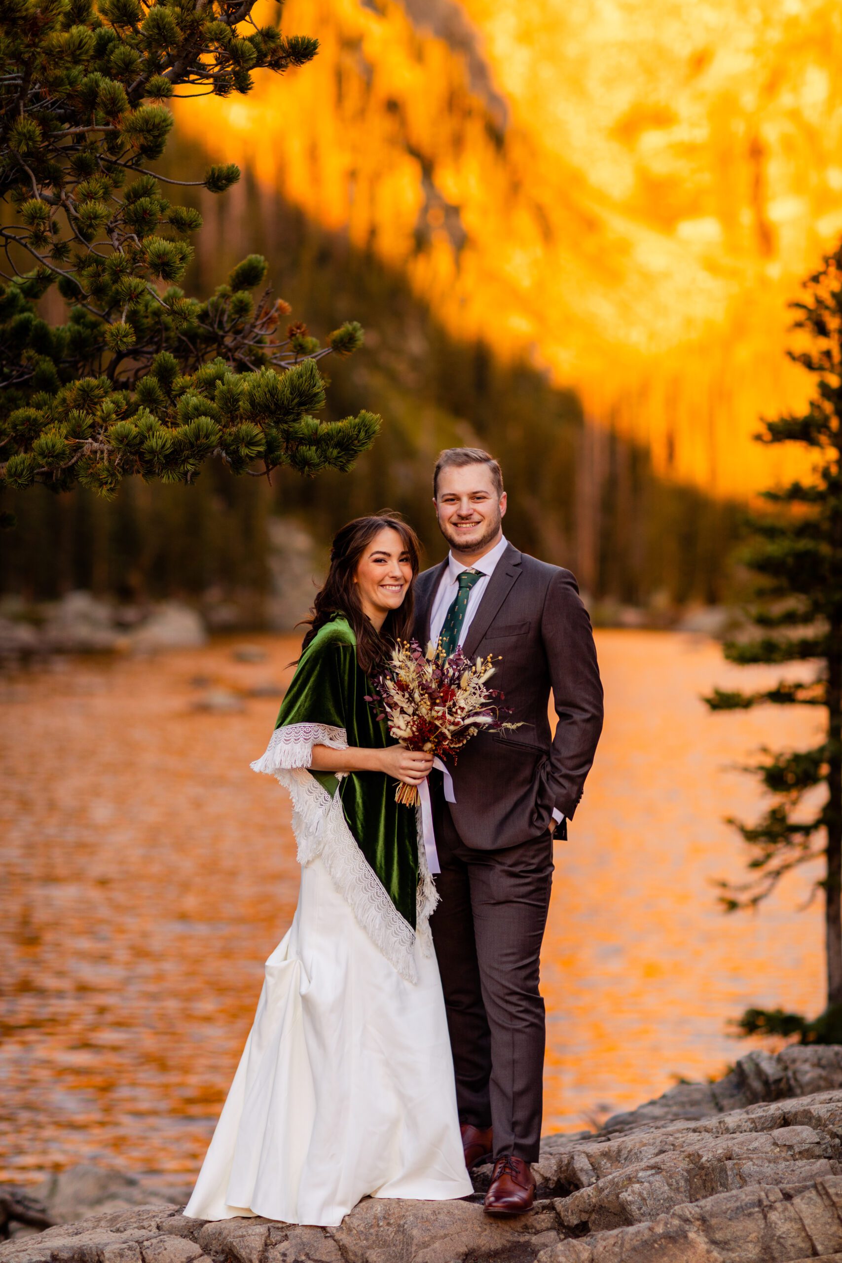 bride and groom smile a the camera at their Dream Lake elopement. 