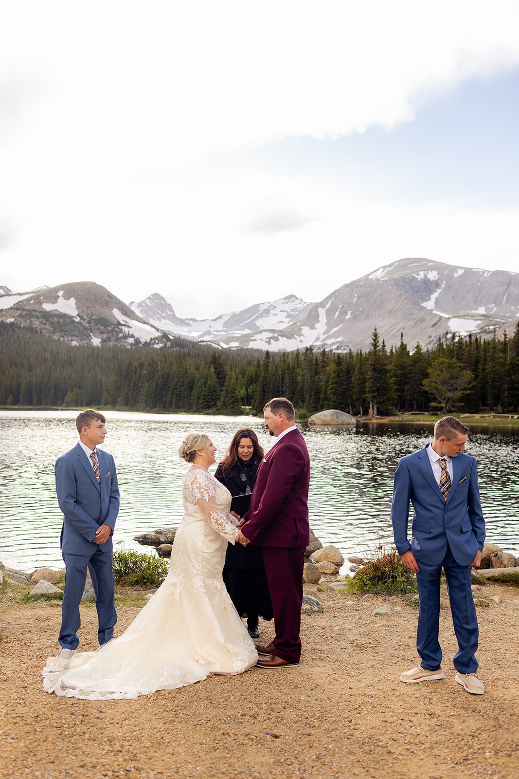 Bride and groom during their Brainard Lake wedding ceremony with their family.