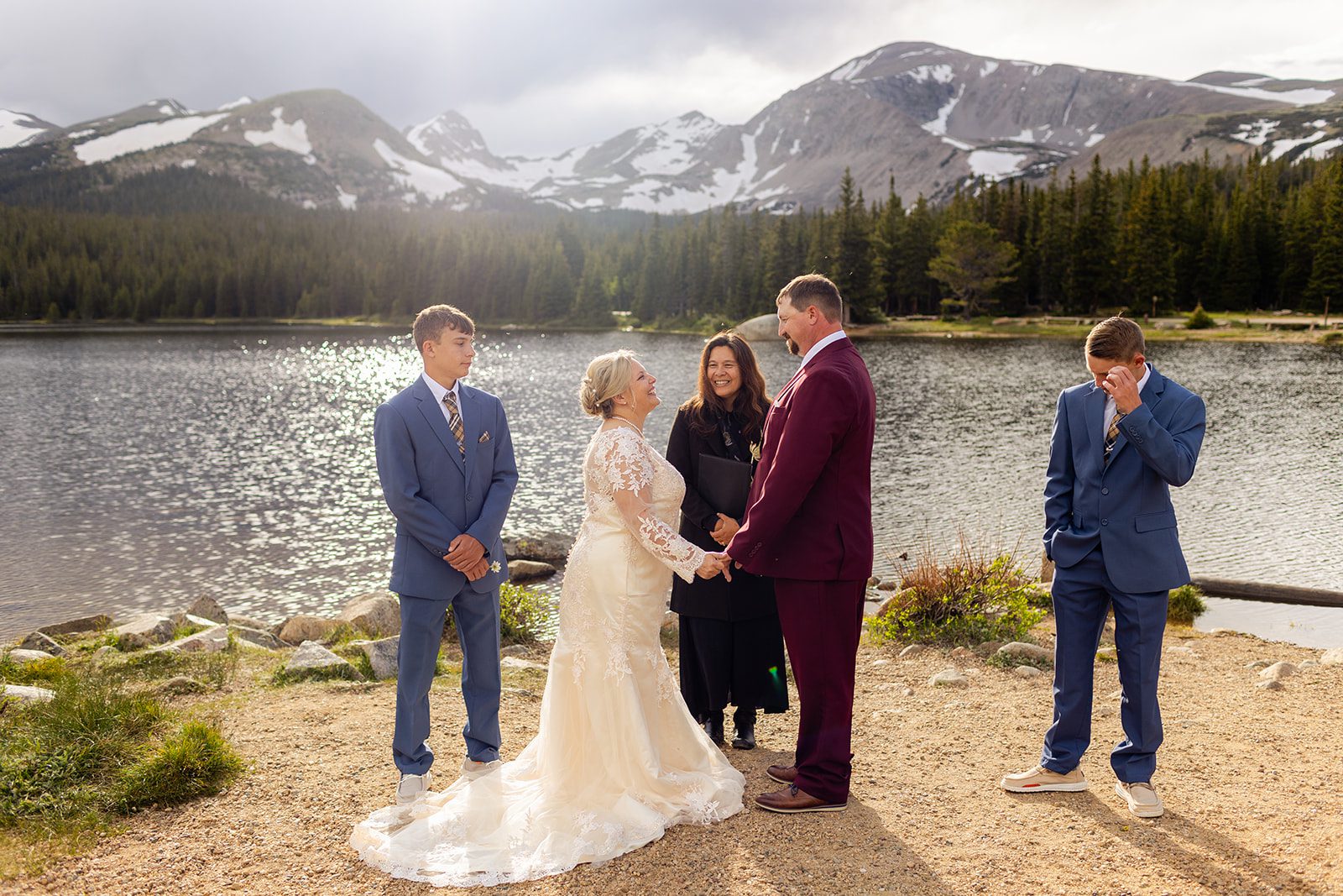 bride and groom with boys near brainard lake for their wedding.