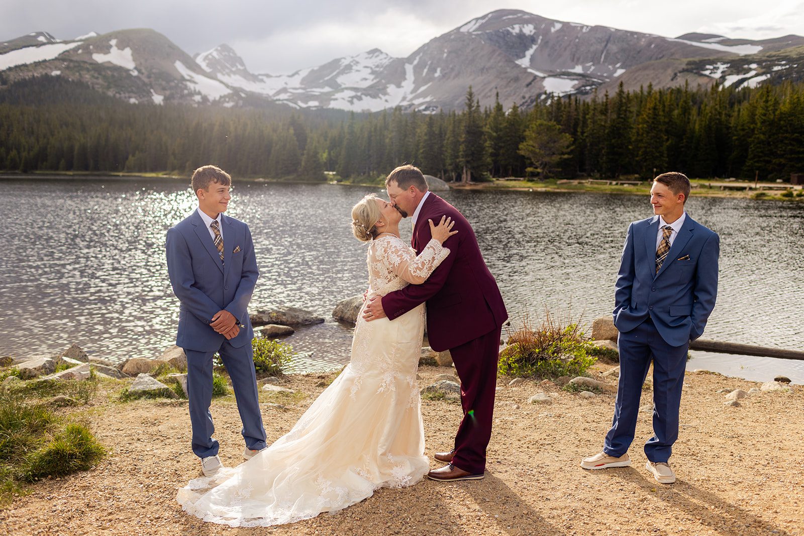 bride and groom are official! their first kiss as husband and wife during their Brainard Lake wedding ceremony