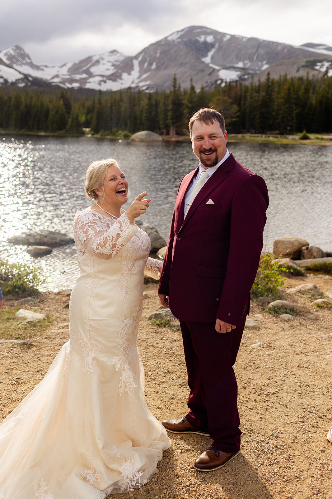 bride and groom laughing near Brainard Lake