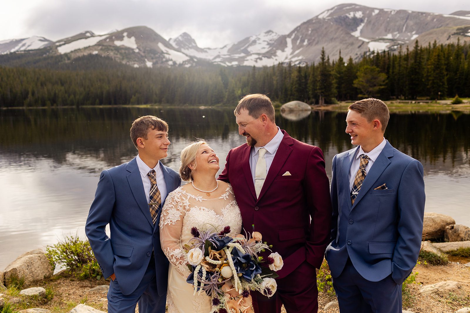 bride and groom with their sons after their wedding at Brainard Lake.